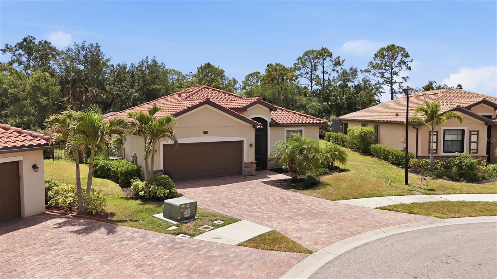 Tucked away on a quiet cul-de-sac in the sought-after Gran Paradiso at The West Villages in Wellen Park, this impeccably cared-for 3-bedroom, 2-bath home offers space, privacy, and an easygoing Florida lifestyle. Set on an oversized lot with extra room between neighbors, it’s a property that feels both open and secluded. Inside, the single-story design is bright and inviting, with a natural flow between the main living areas that makes everyday living feel effortless. The tucked away kitchen, dining, and great room come together as a cohesive space—ideal for casual nights in or hosting friends and family. The real highlight awaits outdoors. A heated pool and spa sit within a large screened lanai, creating a private backdrop for everything from quiet mornings to lively get-togethers. It’s the kind of space you’ll use year-round. The primary suite is designed for comfort, featuring a spacious en suite bath with dual vanities, a soaking tub, and a walk-in shower. Two additional bedrooms offer flexibility, including one outfitted with a Murphy bed—perfect for guests or a functional home office. A cabana bath adds convenience with direct access to the lanai. Life in Gran Paradiso means more than just a beautiful home. Residents enjoy access to resort-style amenities including a pool, fitness center, tennis and pickleball courts, and scenic walking trails. Just beyond the gates, Wellen Park brings even more to enjoy—restaurants, shopping, outdoor spaces, and a full calendar of events, plus nearby Atlanta Braves Spring Training. If you’re looking for a home that blends comfort, privacy, and an active community setting, this one stands out. Don't wait, this beautiful home won't be on the market for long at this incredible price! Welcome Home.