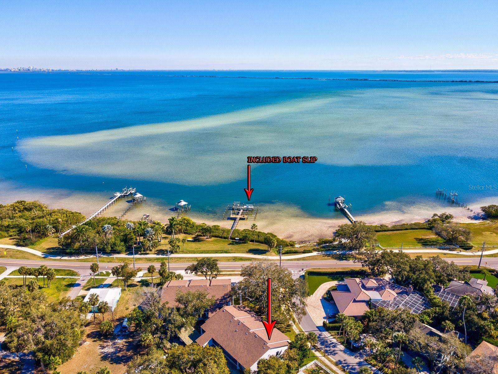 Bring your boat, your kayak, your paddle board and your sense of adventure because this is where coastal living and downtown charm come together in a way that’s truly rare. Perfectly positioned in the heart of Safety Harbor, this top-floor, corner unit residence at Lovers Oak Condominium offers more than just a beautiful home it delivers a lifestyle that few properties can match. Just blocks from the vibrant energy of downtown, recently recognized as one of the most desirable places to live in the Tampa Bay area, you’ll enjoy effortless access to boutique shopping, dining, festivals, and waterfront parks. But what truly sets this opportunity apart is on the water. This residence includes a dedicated boat slip an incredible find this close to downtown, but this unit stands out with one of the best slips in the community, positioned in the deepest water for optimal access. Even more exceptional, the slip is equipped with a lift, offering convenience, protection, and immediate readiness for your next day on the bay. No bridges, no waiting just lower your boat and go. Whether you’re setting out for a sunrise cruise, an afternoon of fishing, enjoying the many dolphins and manatees or a sunset paddle along the shoreline, everything you love about Florida waterfront living is right outside your door. With approximately 144 feet of community waterfront and a planned kayak launch and kayak storage, every day invites a new adventure. Inside this 2 bedroom, 2 bathroom condo with 1 car carport is thoughtfully updated modern finishes, the kitchen and baths blend style and functionality, while the light-filled sunroom showcases sweeping views of Tampa Bay an ideal space to relax and take in the ever-changing water views. Step outside and you’re greeted by the timeless beauty of the iconic 200-year-old Lovers Oak tree, a natural landmark that adds character and charm to your everyday surroundings. From there, it’s just a quick golf cart ride or short stroll into downtown, where community events, art, dining, and coastal culture come alive. For those who love the outdoors, the Ream Wilson Trail sits just across the street and will soon connect to an expansive 75-mile trail network throughout Pinellas County. Whether you’re seeking a full-time residence or a lock-and-leave retreat, this impeccably maintained condo offers the perfect blend of ease, location, and lifestyle, just 20 minutes from both Tampa International and St. Pete/Clearwater airports. Opportunities like this, downtown living with a deep-water boat slip and lift are exceptionally hard to find. Move in, step out, and start living the waterfront lifestyle you’ve been waiting for.