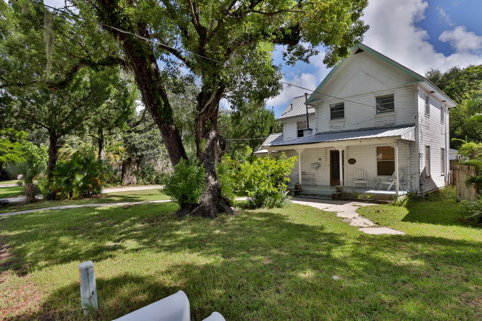 HISTORIC GEM ON BALL STREET WITH RARE LARGE LOT OF .32 ACRES IN HISTORIC CANAL!!  This is a must see home. The home has kept it's historic character with tongue and groove pine walls and ceilings throughout the house, tall 10 ft ceilings, upgraded bathrooms and plumbing, gas appliances including stove, water heater, and furnace with new gas lines and parts. Spanish tile in the kitchen and dining room. Original wood flooring upstairs. Parkay floors in living room. Huge A Frame attic across the top floor. Outside has all the storage and drive way you need. In the backyard there is a 20X40 Pole Barn that you can store an RV or boat under, very large deck behind the garageentertain, 10X20 Anchored down,shed with garage door and electric inside, outside shower, 1/2 bath in garage, 2 large exhaust fans in over sized two car garage to keep the garage cooler, more storage closets in garage, and still home for a nice backyard. This home comes furnished. Both guest bedroom furniture does not convey. With some needed work to be done with the home, there are lots of upgrades to not worry about. New garage rolled roof 2014, Electric panel upgraded in 2002 with sub panels through out the home, upgraded plumbing, metal roof replaced in 2005, new duct work for AC downstairs in 2002, and Upstairs Gas AC in 2010. So much character is kept throughout the home. Call today for a showing as this home will not last long.  Great location walking distance to famous Canal St. with restaurants, shops, art hubs, museums, marina, historic ruins, and great fishing at the Intracoastal waterway. Bring your bikes and you are only 2 miles to Flagler Ave and the beach.  This historic home comes with the historic neighborhood of Ball Street and Canal Street. ;Water: City