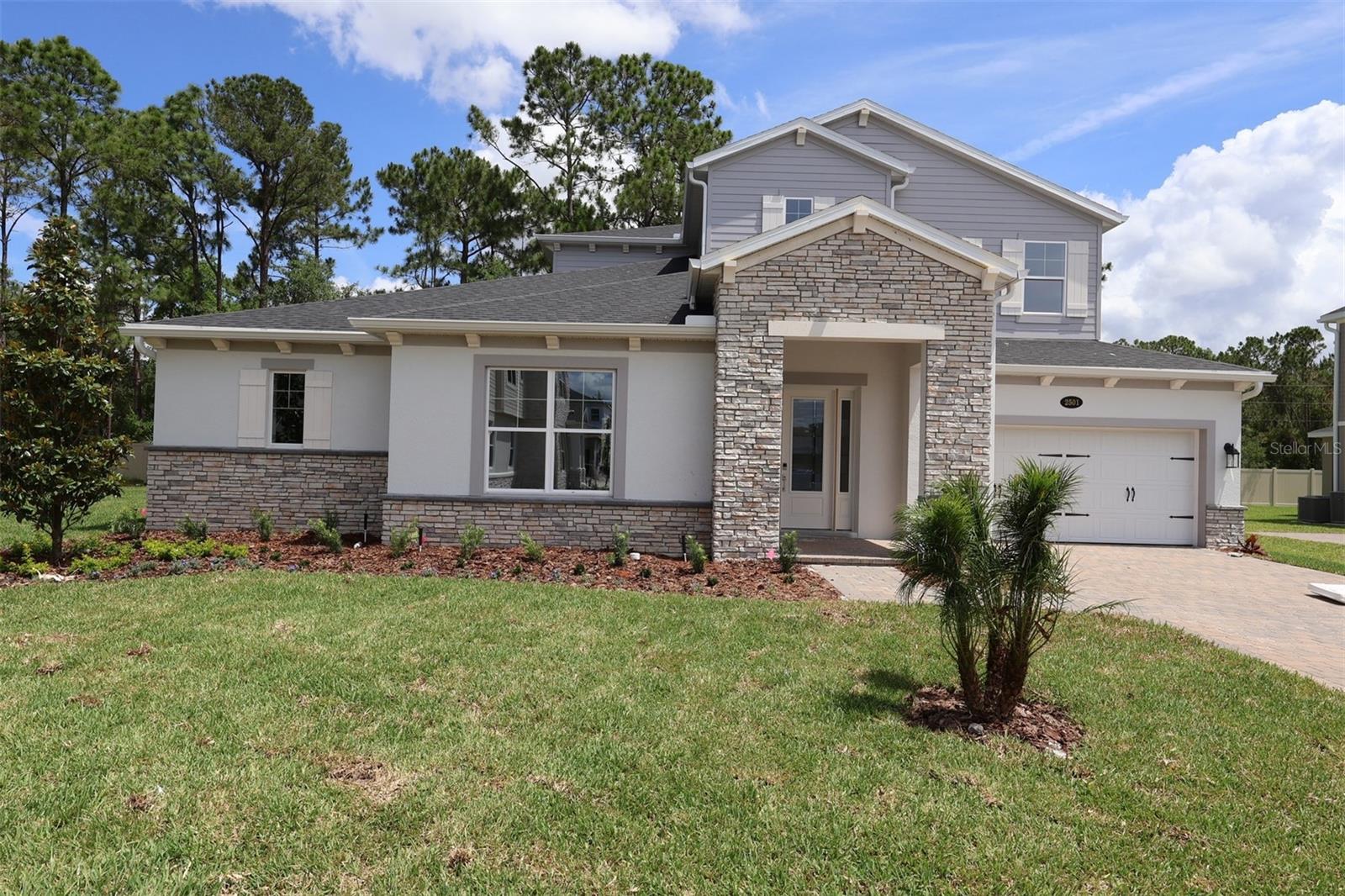 Under Construction. Discover this stunning new construction home at 2501 Hawks Overlook Place in Oviedo, Florida. Built by M/I Homes, this spacious 5-bedroom, 4.5-bathroom home offers 4,076 square feet of thoughtfully designed living space.

The home's quality design is evident throughout, with attention to detail and functional layout that maximizes the generous square footage. The open-concept floorplan seamlessly connects the main living areas, making it perfect for both daily life and entertaining.

The owner's bedroom is conveniently located on the main level, providing easy accessibility and privacy, and features a spa-inspired en-suite bathroom and a massive walk-in closet.

Other highlights include a separate dining room, an extended lanai, a huge upstairs loft, en-suite bathrooms and/or walk-in closets for each bedroom, and a 3-car garage.

This new construction home represents an opportunity to own a quality-built residence in one of Oviedo's desirable neighborhoods, combining spacious living with thoughtful design elements and convenient location benefits. Contact us today to learn more!