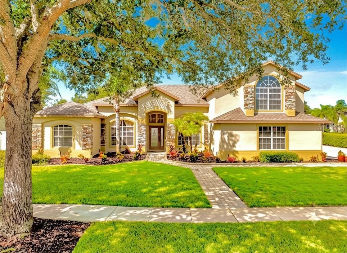 Virtually Staged. Tucked away at the end of a gracefully manicured, tree-lined entry road in a secure 24 hr guard-gated community, this exceptionally maintained 1-story home with a bonus room upstairs offers a rare blend of privacy, space, and resort-style living. Positioned beside the community amenities and set on one of the largest corner lots in the neighborhood at .39 acres, this home makes an unforgettable first impression from the moment you arrive.

Inside, the modern gourmet kitchen is designed to impress with rich granite countertops, stainless steel appliances, and a double oven with air fryer added in 2024. The home features new luxury vinyl plank flooring replaced in 2026 in the kitchen, family room, hallways, and bathrooms, along with wood floors in the master suite, dining room, office/study, bonus room, and stairs. Fresh interior paint enhances the light, clean feel throughout. The floor plan is a desirable 3 way split bedroom plan which affords privacy. Dramatic high ceiling heights, crown molding, French doors, niches and finishes add to the homes appeal. 

The newly renovated 2025 primary bathroom is a true retreat, showcasing a rain shower, separate wall shower head, free-standing soaking tub, and an oversized walk-in custom closet with racks and a large hidden walk-in safe. Attic access from the closet offers floored space for extra storage.

Out back, your private paradise awaits with a spacious brick paver deck, heated spa, umbrellas, and PVC privacy fencing. 2 Double gates and a single gate provide convenient access to the side yard and driveway, while the air-conditioned Florida room overlooks the backyard escape. The side-entry 3-car garage includes an epoxy floor finish, slat wall tool storage, and overhead racks for exceptional organization. Irrigation on a well helps keep the landscape lush while keeping water bills low.

Upstairs, the extra-large bonus room with private bath offers flexible living for a media room, fifth bedroom, craft room, playroom, or man cave/woman cave. Pre-wired surround sound, low-profile theater aisle lights, and a pull-down blackout shade create the perfect setting for movie nights or game day.

Roof replaced in 2021 and two zoned A/C systems replaced in 2021, plus smart thermostat control from your phone, this home combines timeless comfort with modern peace of mind. You'll notice how impeccably clean and well maintained this home is when you see it. 

Community amenities include a resort-style zero-entry pool with splash pad, soccer field, baseball diamond, basketball and tennis courts, playground, lakefront pier, and exercise/bike trail along Lake Apopka. 

Westyn Bay is a gated residential community with controlled access and security, offering easy connections to major roads such as FL-429, the Turnpike, and Highway 50. It is close to shopping and restaurants at Fountains West (Publix), West Colonial Drive, Winter Garden Village, and the historic Downtown Winter Garden, known for its charming ambiance with shops, dining and award winning events and farmers market. Bicycle and fitness enthustiasts can hop on the West Orange Bike Trail just outside of the neighborhood. Nearby hospitals include AdventHealth Apopka, Health Central, and AdventHealth Winter Garden. Downtown Orlando is about 11 miles away, and Disney, Universal, and the airport are roughly 20 to 30 minutes by car. Schedule a showing for this home today—waiting could mean missing out on this opportunity.