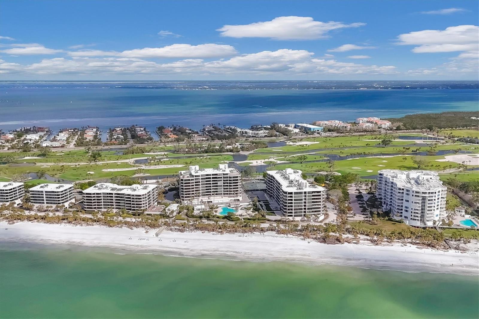 Discover the pinnacle of coastal luxury in this magnificent 8th-floor northeast corner residence, perfectly positioned within one of Longboat Key’s most sought-after communities. Revel in sweeping, unobstructed views of the Gulf of Mexico, Sarasota Bay, Downtown Sarasota, the
Longboat Key golf course and beyond. With a generous 2,375-square-foot floor plan, this exquisitely appointed home offers two spacious bedrooms, a convertible den/third bedroom and two-and-a-half baths. Every detail of this residence exudes sophistication. The turnkey-furnished interior features soaring ceilings, gleaming marble floors and a light-filled kitchen with an island centerpiece designed for functionality and elegance. The kitchen, equipped with Bosch and Sub-Zero appliances, ample storage and an inviting dining nook, seamlessly blends modern convenience with timeless style. Floor-to-ceiling glass sliders frame the panoramic vistas, while wraparound terraces provide the ultimate setting for sunrise coffee or evening cocktails. Nestled behind the gates of the exclusive Longboat Key Club, The Sanctuary offers a resort lifestyle unmatched in its amenities and beauty. The community boasts 1,200 feet of pristine white sand beach, a heated Gulf-side swimming pool with a 25-meter lap area, an outdoor whirlpool spa and a charming beachfront gazebo. Two lighted Har-Tru tennis courts and a state-of-the-art fitness center provide endless recreation opportunities, while saunas and an entertainment room ensure relaxation and social enjoyment. On-site management, 24-hour security and meticulously maintained grounds enhance the sense of exclusivity and convenience. The community also offers private boardwalk access to the beach, allowing residents to enjoy Longboat Key’s serene shoreline just steps from their door. Whether indulging in the luxurious amenities, soaking in the unparalleled views or entertaining guests in your stunning corner residence, life at The Sanctuary redefines coastal elegance. Come and experience why this extraordinary residence is the ultimate address on Longboat Key.