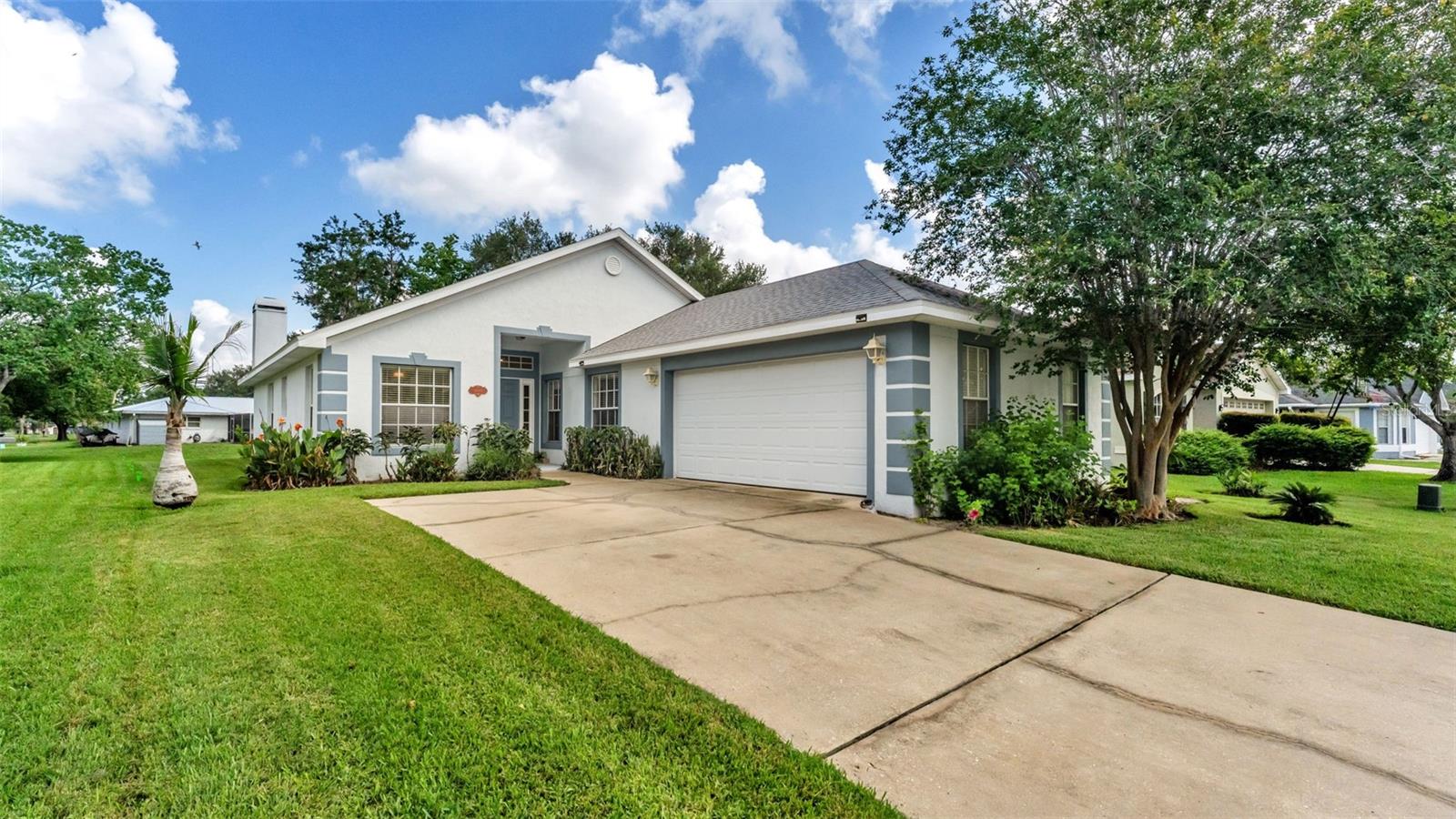 Virtually Staged. Welcome to 1754 Turtle Rock Court, where peaceful waterfront living meets an exceptional South Lakeland location. Tucked away on a quiet cul-de-sac in the established Turtle Rock community, this beautifully updated 3-bedroom, 2-bath residence offers 1,753 square feet of thoughtfully designed living space with tranquil water views that create the perfect backdrop for everyday living. From the moment you arrive, you'll appreciate the home's inviting curb appeal and mature landscaping. Inside, soaring ceilings, abundant natural light, fresh neutral finishes, and new luxury vinyl plank flooring (2025) create a bright, airy atmosphere throughout the open-concept floor plan. The spacious living room centers around a charming wood-burning fireplace, providing both warmth and character while seamlessly connecting to the dining area and kitchen. Designed with both functionality and entertaining in mind, the kitchen features generous countertop space, updated appliances, a breakfast bar, and a sunny eat-in dining area overlooking the living spaces. Expansive sliding glass doors invite the outdoors in, leading to a private patio where you'll enjoy peaceful mornings with coffee or relaxing evenings overlooking the beautiful waterfront setting. The spacious primary suite serves as a private retreat with tranquil water views, a large walk-in closet, and an en-suite bath featuring dual vanities and a tub/shower combination. Two additional bedrooms, a well-appointed guest bath, an indoor laundry room, and an attached two-car garage complete this comfortable and practical floor plan. Significant recent improvements provide peace of mind, including a new roof (2023) and a new HVAC system (2025), allowing the next owner to simply move in and enjoy. Ideally located just minutes from downtown Lakeland, medical facilities along with the new Orlando Health and Watson Clinic, shopping, dining, recreational amenities, and convenient Polk Parkway access, this home offers the perfect combination of privacy, convenience, and natural beauty. If you've been searching for a move-in-ready waterfront home with tasteful updates, inviting living spaces, and a location that's hard to beat, 1754 Turtle Rock Court is ready to welcome you home.