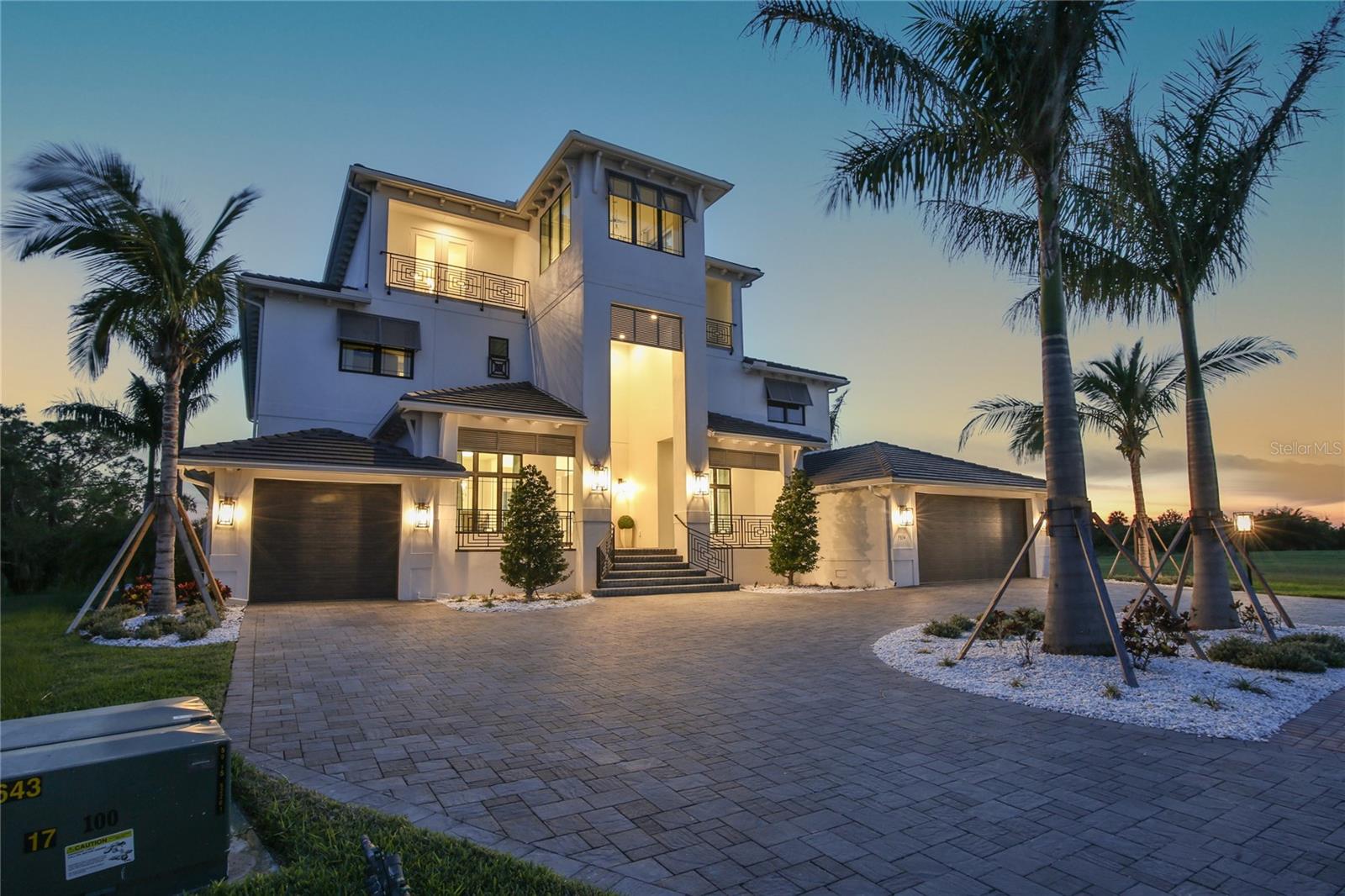 Located in the gated Community of Legends Bay the St. Regis model home with 4 spacious bedrooms and 5.5 elegant baths offers privacy with plenty of space to entertain family and friends.
Move in ready.

With a large lanai and courtyard, five view-enhancing balconies and a three-car garage it has everything you could imagine in a luxury Florida estate. The residence features a grand, two-story foyer, greeting you with soaring, 12-foot ceilings. For all your entertaining needs, there's a formal dining room and den, and the great room offers views of the backyard with pool, spa and sun shelf through a wall of sliding glass doors. Tranquility, seclusion and privacy surround this luxurious furnished property.  There's ample room for you to prepare the most delicious meals in a fully-equipped kitchen with a walk-in pantry and butler's pantry. The exclusive first-floor owner's suite is accessed by a private hallway that leads to a luxe bedroom with direct access to the lanai and a sunlit sitting area. The en-suite bathroom details are amazing with dual vanities, linen closet, soaking tub, and tiled walk-in shower, that will make your end-of-day routine feel like a trip to the spa, each and every single day. On the second level, two rear-facing balconies let you enjoy the warm Florida breeze in privacy along with a front balcony. You'll find three bedrooms, each with their own attached walk-in closet and bathroom, a large bonus room and a powder room. The third level features an entertainment space complete with access to a large balcony with beautiful views of the Sarasota Bay, downtown Sarasota, Longboat Key and nature preserve, a wet bar and a powder room. An elevator provides easy access to every floor. If you are ready to experience luxury in a way that only a St Regis Model can provide, welcome home.