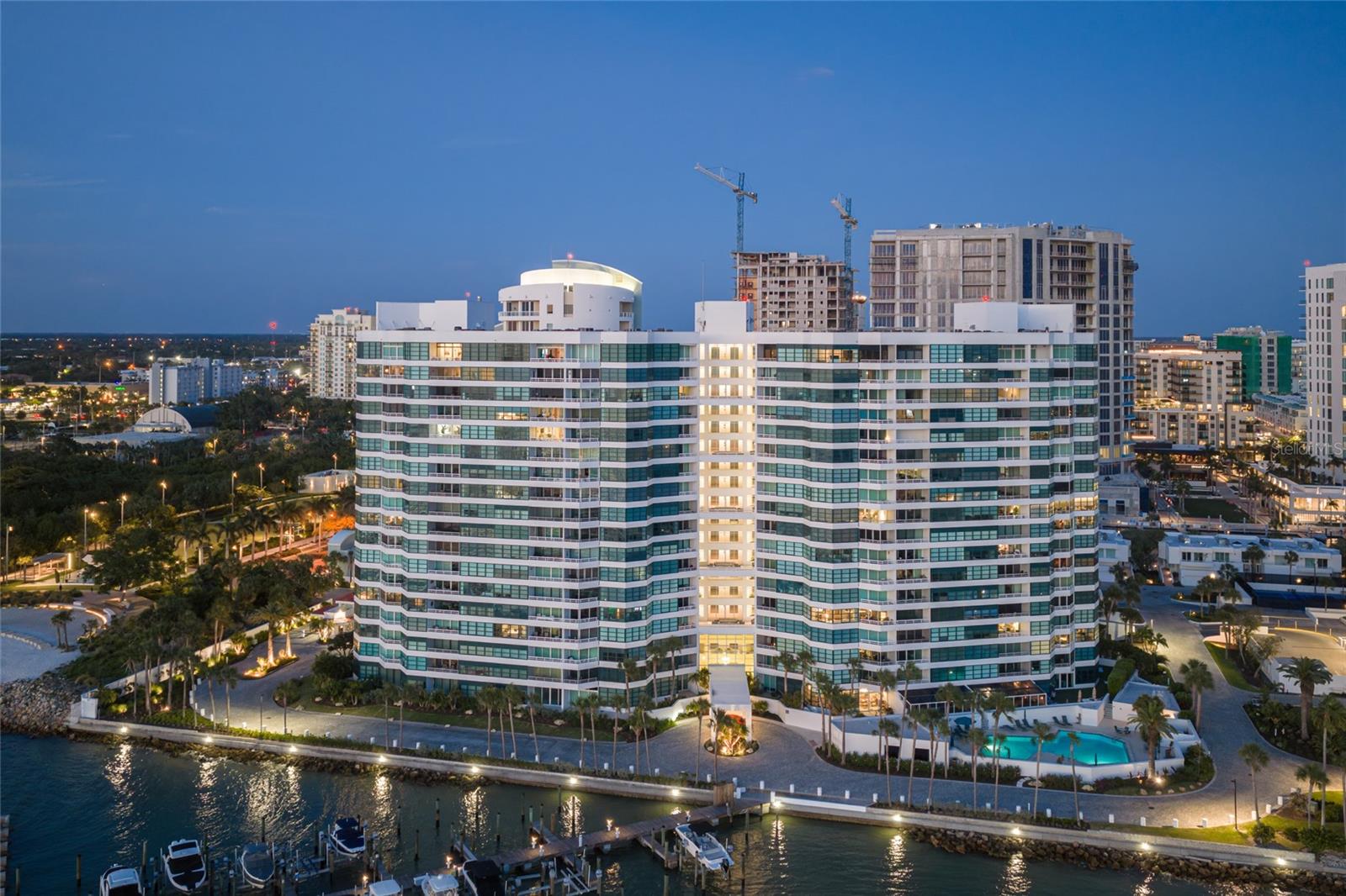 Mesmerizing, unobstructed views of Sarasota Bay and the Gulf of Mexico set a breathtaking stage from this towering 17th-floor residence at Condo on the Bay, where sky, water and city lights create an ever-changing coastal panorama. Perfectly positioned on a private peninsula in the heart of Sarasota, this home captures elevated waterfront living with a rare sense of openness and tranquility. From sunrise reflections over the bay to golden sunsets across the Gulf, every moment is framed by water. Expansive windows and floor-to-ceiling glass sliders draw your eye outward, while a spacious, covered balcony offers a front-row seat to passing boats, seabirds and Sarasota’s natural shoreline. Upon entry, the view takes center stage, complemented by a custom built-in buffet with a wine cooler as well as French oak plank flooring. The renovated kitchen features new stainless steel appliances, updated fixtures, Campbell solid wood cabinetry and striking Cambria quartz countertops that extend seamlessly along the full wall, creating a clean, modern statement. A pass-through design connects the kitchen to the dining and living areas, enhancing light and flow, with additional built-in cabinetry providing generous storage. The living space is thoughtfully designed with a floating media cabinet, a Samsung Frame TV and a Sonos sound bar included. In the primary suite, custom details continue with floating nightstands, a wood canopy bed and a spacious walk-in closet with built-ins, while a wall of windows showcases sweeping views of the bay, Longboat Key and the Gulf beyond. Both baths have been fully updated with new cabinetry, tile and countertops and the guest bedroom features an oversized closet with custom built-ins. Tinted glass entry doors throughout the residence add a refined contemporary touch. Residents of Condo on the Bay enjoy a secure, gated environment with 24-hour concierge and security, along with amenities that include two resort-style pools, tennis courts, two fitness rooms, social spaces and a private marina with boat slips available for lease. Kayak launches, a fishing pier and waterfront walking paths further enhance the coastal lifestyle. Directly next to The Bay, Sarasota’s transformative 50-plus-acre waterfront park, residents have immediate access to scenic trails, performance venues, open green space and year-round cultural programming. Downtown Sarasota’s renowned dining, arts and cultural scene is just moments away, along with St. Armands Circle and the white sand beaches of Lido Key. Whether as a full-time residence or seasonal retreat, this is a rare opportunity to own a premier position in Sarasota’s skyline, offering panoramic water views, exceptional amenities and unmatched proximity to downtown coastal living. Furnishings are available on a separate schedule.