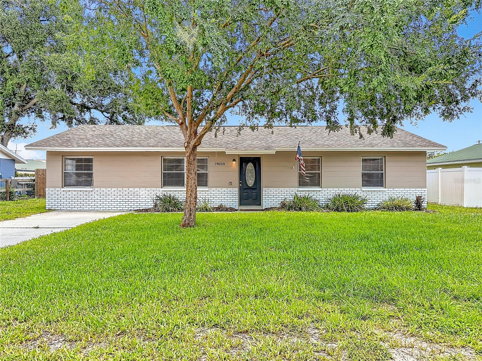 Virtually Staged. Discover your perfect Florida retreat at 14800 11th St in Dade City, FL 33523 — a beautifully updated one-story block home offering comfort, style, and modern peace of mind in a welcoming community.
This charming 4-bedroom, 2-full-bath residence features wood-look laminate flooring and tile throughout, creating a warm and durable flow from room to room. The updated kitchen shines with elegant granite counters and rich wood cabinets, making meal prep a delight for family gatherings or casual entertaining. Both bathrooms have been tastefully refreshed for a fresh, spa-like feel. Outside, a large fenced rear yard provides plenty of space for pets to roam, kids to play, or relaxing evenings under the Florida sky. Recent major updates ensure worry-free living, including a 2020 roof, 2020 AC system, and a 2024 water heater.
Dade City’s historic charm and convenient location make this home even more appealing. Just minutes away, explore the Pioneer Florida Museum & Village, where you can step back in time with exhibits on early Florida life. Nature enthusiasts will love the nearby Withlacoochee State Trail (a scenic 47-mile paved path for biking and walking), Withlacoochee River Park for fishing, hiking, and camping, and the expansive Green Swamp Wilderness Preserve offering birding, paddling, and trails.
Families and animal lovers can head to Giraffe Ranch for unique safari tours featuring giraffes and other exotic wildlife. Downtown Dade City invites you with antique shops, boutique stores, cozy eateries, and annual events like the Kumquat Festival. All of these attractions—and more—are within a short drive, placing you in the heart of Pasco County’s blend of Old Florida heritage and outdoor adventure.
Whether you’re seeking a peaceful family home or an inviting investment property, this updated gem in Dade City delivers comfort, convenience, and connection to everything Central Florida has to offer.