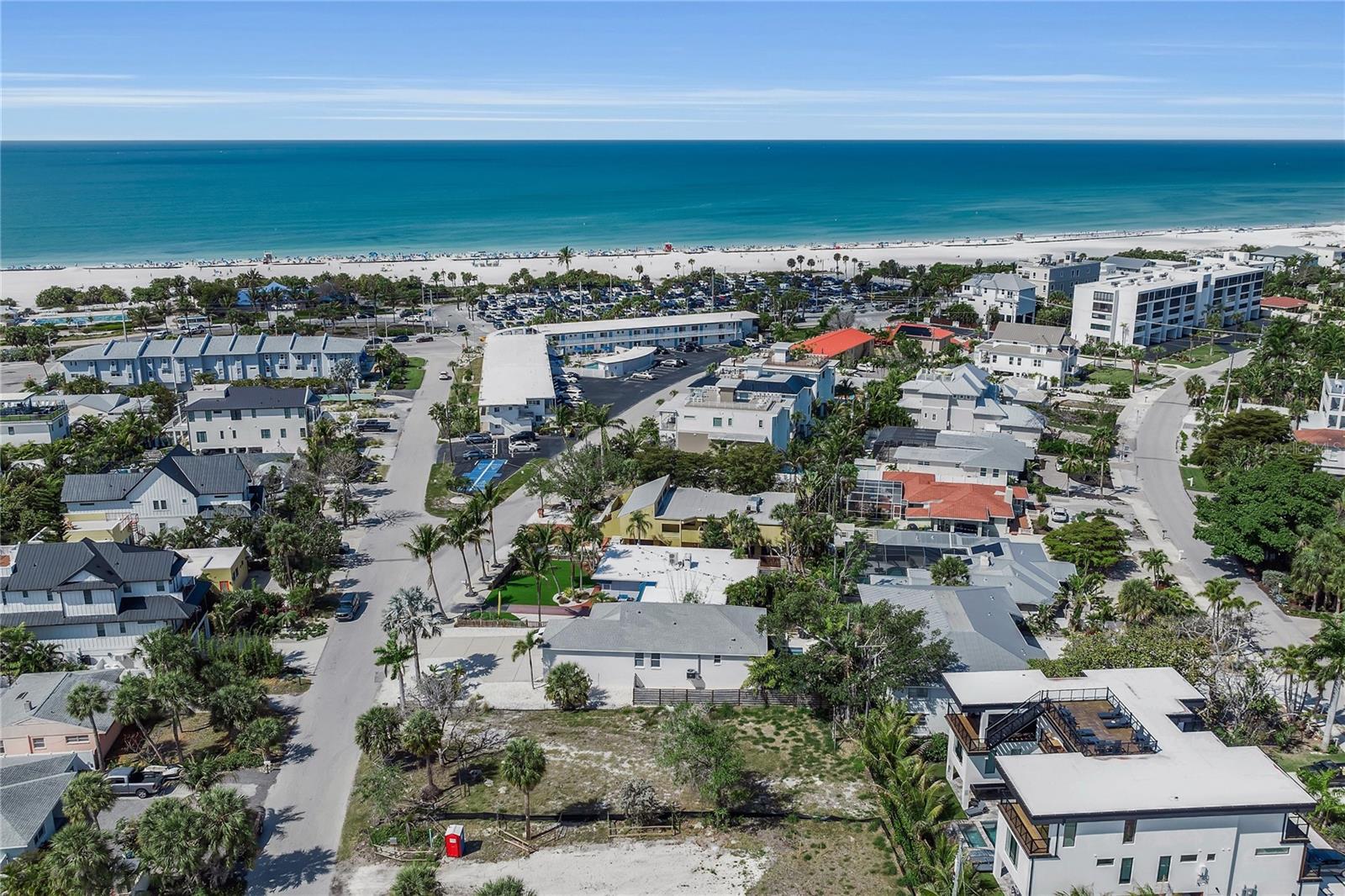 Create your modern coastal residence just moments from the sugar-sand shoreline on this rare, cleared homesite in the heart of Lido Beach. Measuring approximately 60-by-115, this property is ideally positioned for an effortless island lifestyle with access to the Gulf, the boutiques and dining of St. Armands Circle, and a short drive to vibrant downtown Sarasota. Zoning that allows seven-day rentals provides exceptional versatility for a future luxury home or investment-minded design. Architectural plans available. Build a three-story contemporary coastal residence featuring a rooftop deck, owners can capture both Gulf and Sarasota Bay sunset views, an elevated vantage point that defines the Lido Beach lifestyle. This is a premier opportunity in one of Sarasota’s most sought-after beach communities.