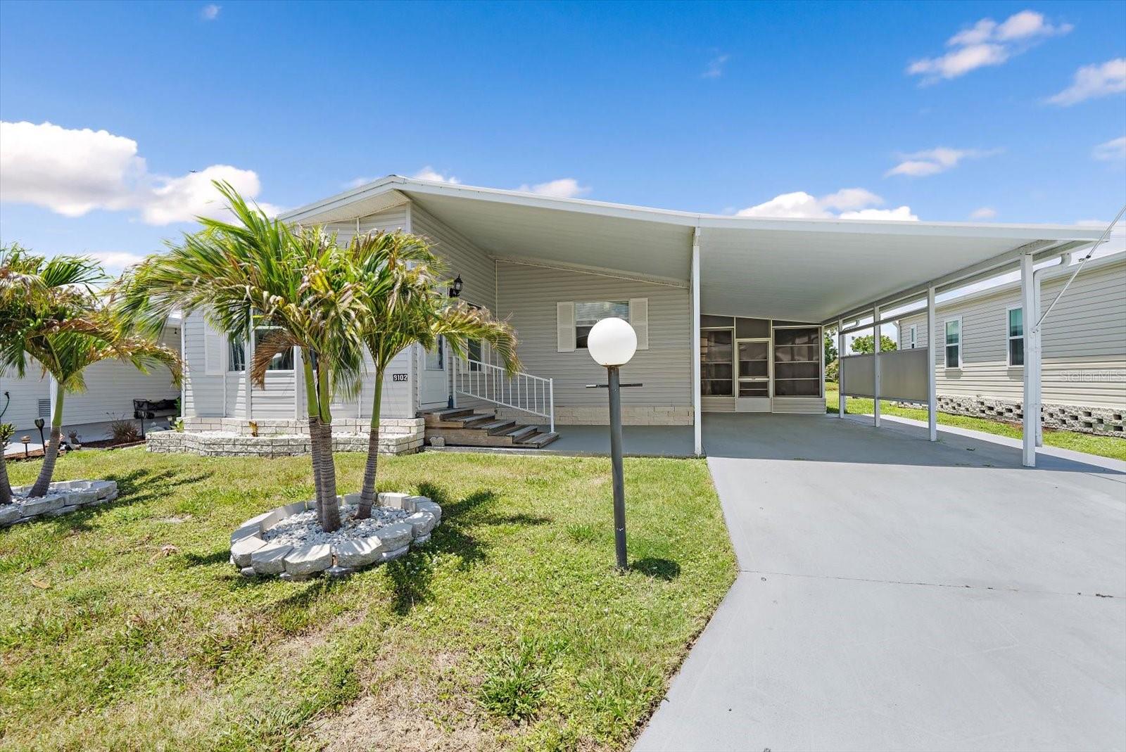 Welcome to your next chapter in Terra Siesta, a sought-after 55-plus cooperative community nestled in the heart of Ellenton. This beautifully updated two-bedroom, two-bathroom manufactured home offers an impressive 1,522 square feet of thoughtfully designed living space that truly feels like home.

Step inside and immediately appreciate the waterproof vinyl plank flooring that flows seamlessly throughout, complemented by skylights that bathe every room in natural light. The custom-built kitchen is a true standout, featuring elegant slate appliances, slow-close drawers, pull-out shelving, and an upgraded backsplash that elevates the entire space. Every detail has been carefully considered for both style and functionality.

Outside, the covered carport provides convenient vehicle protection, while the screened lanai offers the perfect spot to unwind and enjoy a serene water view right from your own lot. A dedicated storage shed with an integrated laundry room adds exceptional practicality to this well-appointed property.

The neighborhood itself is a genuine gem. Terra Siesta residents enjoy a wonderful clubhouse, community pool, and park — creating endless opportunities for socializing and recreation. The location is equally impressive, situated just minutes from Ellenton Outlets, diverse dining options, and abundant entertainment venues. Quick access to Interstate 75 makes travel effortless, and the stunning Gulf Coast beaches are a short drive away for those sun-soaked afternoons.

This is more than a home — it is a lifestyle. Schedule your private showing today and discover why Terra Siesta continues to be one of Ellenton's most desirable communities.