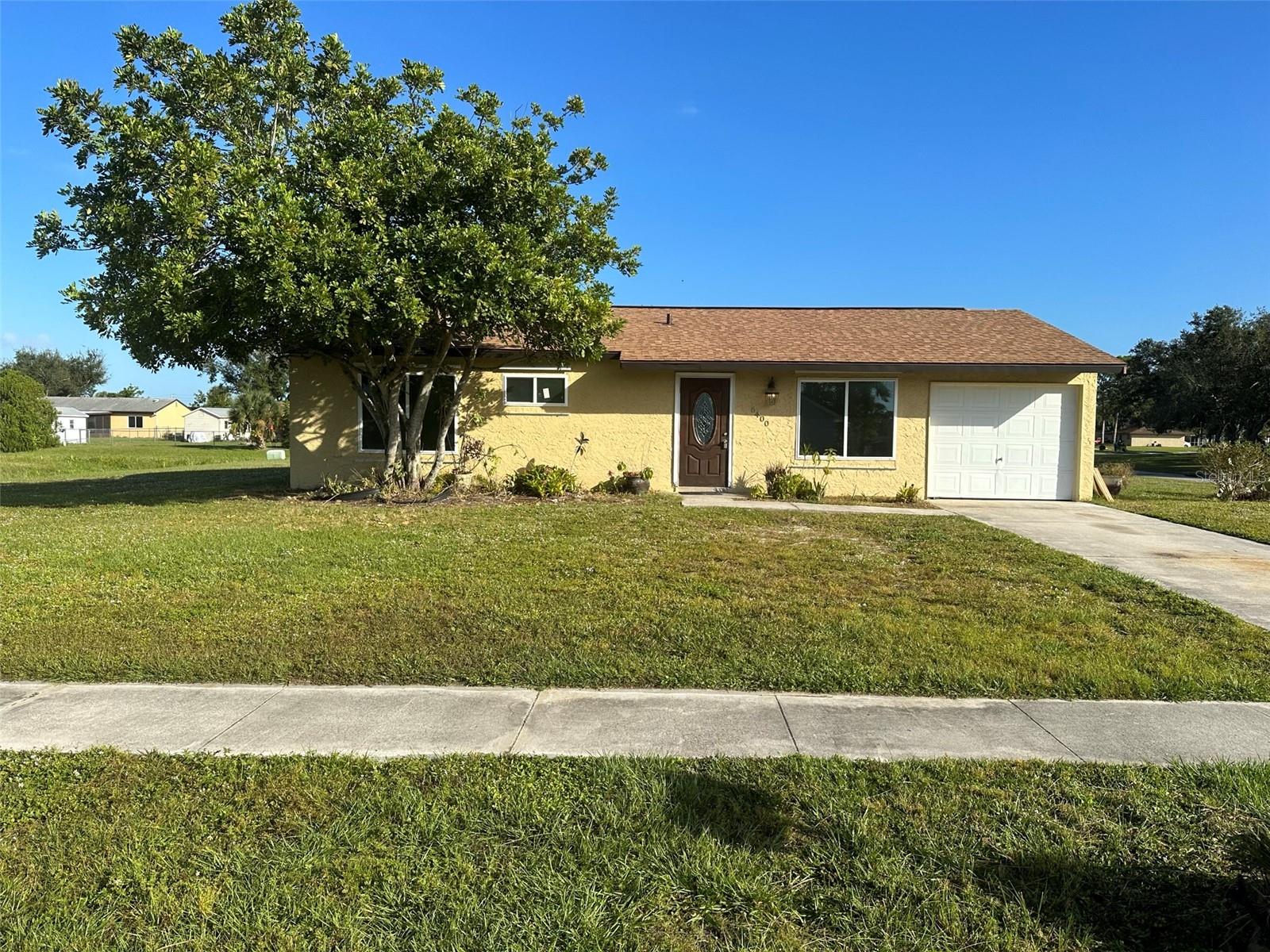 "Welcome to your new home in the heart of North Port, Florida! This charming 2-bedroom, 2-bathroom residence is perfectly nestled on an oversized corner lot, offering space and privacy for you and your loved ones. Step inside to discover a fresh and inviting interior, with recently updated kitchen, and new interior paint that sets the stage for your personal touch. Low maintenance tile floors throughout. As you dine in the bright and airy dining room, the sliding glass door provides a picturesque view of the expansive backyard, creating the ideal backdrop for family gatherings and relaxation. This home has seen some significant updates in recent years, with a brand new roof in 2022 and an upgraded electrical panel in the same year. The plumbing was also taken care of, having been re-piped in 2017, ensuring that your new home is not only beautiful but also functional and worry-free. With a one-car garage, you have the convenience of covered parking and extra storage space. This property is the perfect canvas for you to make your own and create lasting memories in a peaceful North Port neighborhood. Investor?? This home has a great rental history!!!!
Don't miss this opportunity to make this house your home. Contact us today to schedule a viewing and see how this lovely property could be the perfect fit for your family."