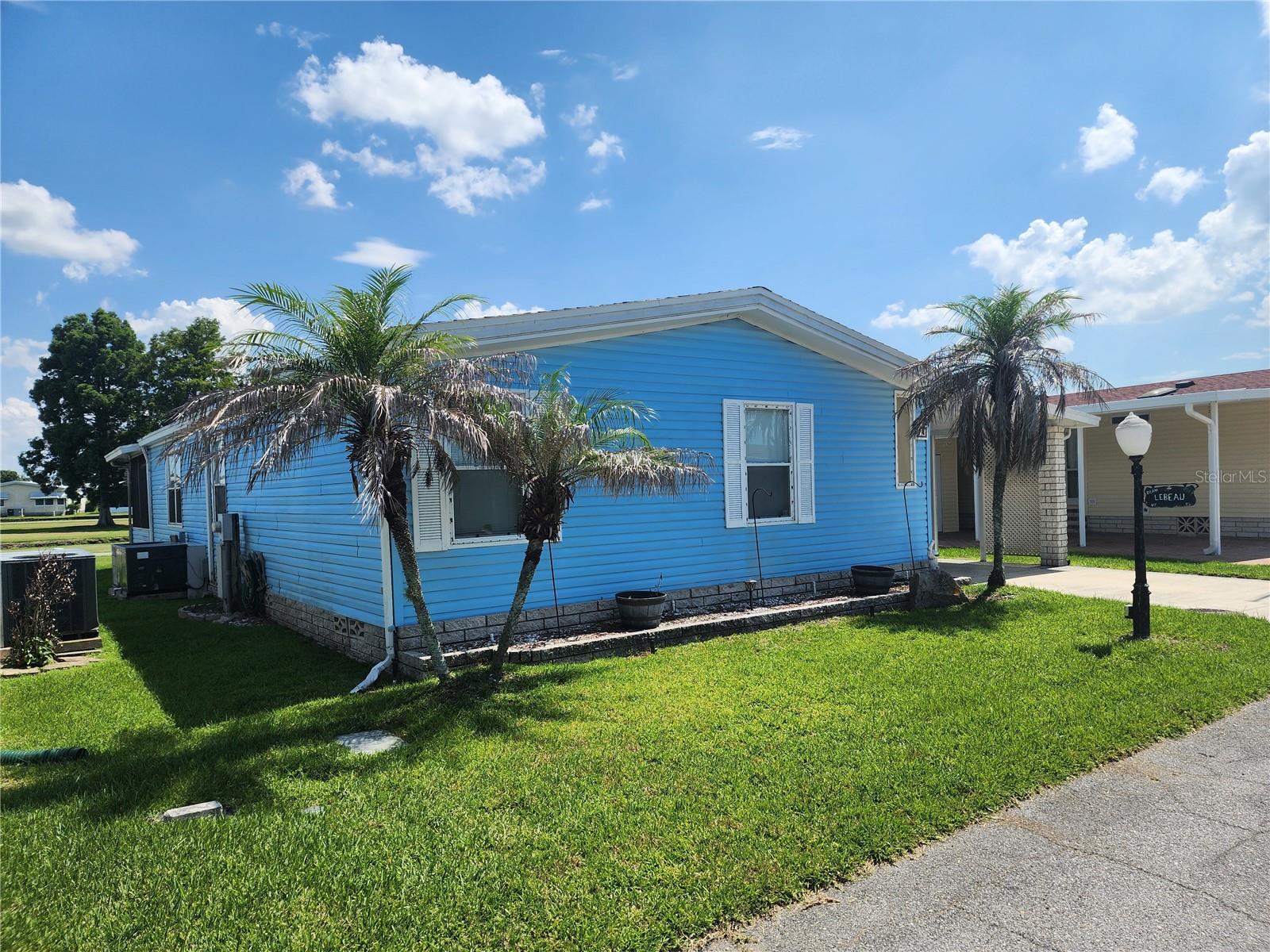 ASSUMABLE VA Loan at 3% @approx 75LTV!!! GOLF COURSE FRONTAGE, FULLY FURNISHED, EXCELLENT CONDITION! Resort style living for an affordable price! This is the most amenities you will get for the price!  The HOA includes internet, cable, sewer and water, basically everything except your electric bill lawn maintenance! This extremely well maintained  Double Wide is 1248 sf with 2 beds/2 baths, includes a private lanai off the Living Room over looking the canal and golf course. Back porch also overlooks has the view. Kitchen has SS appliances and a double sink. Ready to move in and enjoy!

 2023 roof, including carport plus gutters. All furniture stays upon request (ask for a list)! The laundry is currently in the hall bathroom but is piped for the garage/shed as well; Large workshop and storage area. 


AMAZING AMENITIES!! Enjoy 18 holes of golf for just $5 green fees. Gated, Golf Community. Other amenities include, Pickle Ball and Tennis courts, Horseshoe Pit, Bocci Ball, indoor and outdoor shuffleboard, private dock for $35 a month, RV and Rec Vehicle storage for $35/ mo, boat house with grill and screened in with tables and chairs free of charge, kayak storage, large pier with boat ramp and fish cleaning station.approx. Large Clubhouse with heated community pool, hot tub, private bar and grill, library, Pool tables, craft rooms, dozens of social clubs, Dance hall and ballroom, with Bar,  and 24/7 fitness center. In this very friendly, resident-owned community, you can be as active or inactive as you choose! HOA INCLUDES A DVR PLUS 2 HD CABLE BOXES AND INTERNET! (Minimum age in this 55+ community is 50 years old) EFF 9/1/25,$50 APPLICATION FEE 


1.25 hrs. from either coast. Great access to Disney, Legoland, and BOK Tower, just to name a few local attractions.

SPECIAL FINANCING OPTIONS - Sellers lender will credit up to $4,000 to use their lender. Can be used toward buyer agent commission, closing costs or rate buy down.