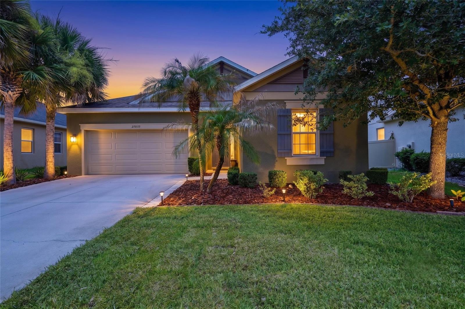 Imagine coming home to your own PRIVATE HEATED SALTWATER POOL with a waterfall and paver deck! Located in Arbor Woods, a GATED community with a LOW HOA and NO CDD, this Taylor Morrison home offers 4 bedrooms, 3 bathrooms, a 2-car garage with storage racks, and a triple-split floor plan designed for added privacy.

The open-concept living area flows into a beautifully appointed kitchen featuring quartz countertops, stainless steel appliances, gas cooking, abundant counter space, a butler’s pantry, and an oversized walk-in pantry. Diagonally laid tile with decorative inlays, 5-inch baseboards, crown molding, and triple sliding glass doors add character throughout the home while connecting the interior to the pool area.

The spacious primary suite includes a walk-in shower, jetted soaking tub, and generous walk-in closet. Additional features include a laundry room with cabinetry, tankless water heater, and irrigation system.

Arbor Woods offers a community pool, playground, parks, and walking trails. Enjoy convenient access to I-75, I-275, Tampa Premium Outlets, The Shops at Wiregrass, restaurants, shopping, and everyday conveniences. Schedule your private showing today!