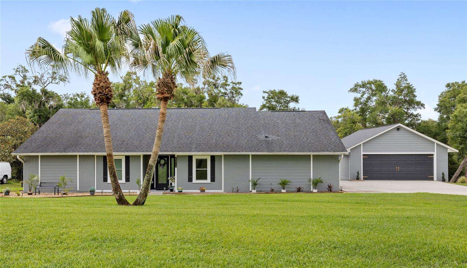 Welcome to 23710 Sundance Drive, a beautifully updated pool home in the highly sought-after Sundance Ridge community of Sorrento. Situated on over 0.81 acres, this property offers peaceful living with convenient access to all that Central Florida has to offer.
The home is 3 bedrooms and 2 bathrooms, with space for a home office. The home spans 2,000 square feet of single story living. Inside, you'll find new flooring throughout, updated light fixtures, a stunning remodeled primary bathroom featuring a new walk-in shower, and a beautifully refreshed kitchen complete with updated cabinetry, new granite countertops, new backsplash, and new appliances. Additional interior improvements include a new front door, updated bedroom doors and hardware, and all-new windows installed in 2022. Major system updates include a new AC (2025), new well (2025), new pool pump (2024), new irrigation control panel (2024), and a garage door opener and spring replacement. The home is also wired for a generator. Step outside to your private backyard retreat where the resurfaced pool (2021) sits in the newly rescreened enclosure (2024). Enjoy views of a neighboring 25-acre horse pasture, creating a serene backdrop rarely found in today's market. One of the property's most unique features is the detached 720-square-foot oversized two-car garage, complete with a dedicated workshop area and private half bath. Behind the garage, you'll find a dedicated parking pad for your RV or boat, and Sundance Ridge allows owners to store recreational vehicles on-site.
Located just minutes from Mount Dora, Lake Mary, and the rapidly growing Kelly Park Corridor in Apopka, this home offers the perfect balance of privacy, space, and accessibility. Call today to schedule your private tour.