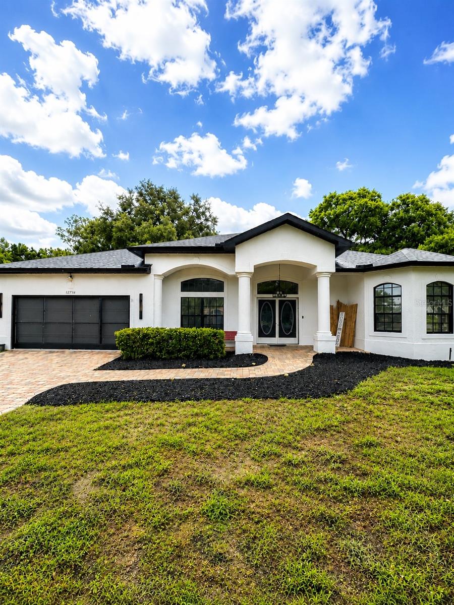 Welcome to this beautifully maintained split-bedroom pool home, ideally situated on a quiet dead-end street with peaceful wooded views and exceptional curb appeal. The attractive brick paver driveway, walkway, covered lanai, and screened pool area create the perfect setting for relaxing or entertaining.
Inside, you'll find an open and inviting layout with soaring ceilings, a grand double-door entry, transom windows, and abundant natural light. The spacious primary suite features private access to the pool, two double closets, and an ensuite bath with dual vanities, a garden tub, and a separate walk-in shower. One of the guest bedrooms also offers direct access to the pool, while a charming bay window highlights the front bedroom.
The kitchen is designed for both functionality and style, featuring a center island, breakfast nook, and updated flooring. Additional features include a screened garage door, irrigation system, and numerous thoughtful upgrades throughout.
Major updates provide peace of mind, including a new roof (2026), exterior paint (2026), and a 2023 HVAC system with UV light sanitizer. The air ducts were also professionally cleaned in 2023.
Best of all, there's no HOA, no CDD, and no flood insurance required.
This move-in-ready home truly has it all! Schedule your private showing today before it's gone!