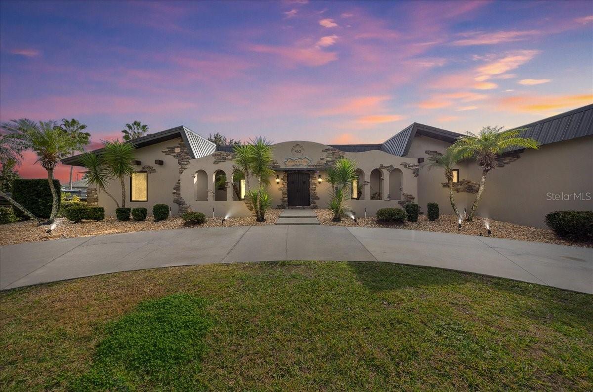 Ladies and Gentlemen, welcome to where coastal living meets uncompromised luxury.
If you know the water here, you know the difference between waterfront and true waterfront. This is the real thing; direct access out to Kings Bay with no overhead bridges between your dock and the Gulf. Your 25-footer is off the lift and on world-class flats, scallop grounds, or sandbars before your coffee has time to cool.
Perfectly positioned just minutes, or an easy golf-cart ride from downtown Crystal River, this one-of-a-kind courtyard-style waterfront estate blends luxury, privacy, and a serious boating lifestyle in a way few properties ever do.
The home is designed for how you actually live on the water. A thoughtfully planned split floor plan allows multiple couples, family, or guests to enjoy the home without feeling crowded. One primary suite features its own private exterior entrance and functions almost as a separate residence. Two additional bedrooms share a Jack-and-Jill bathroom, ideal for couples or close family, while a second primary suite offers a spacious walk-in closet and a luxury walk-in shower. A convenient half bath is located off the grand salon for guests.
Travertine flooring flows throughout, not just beautiful, but practical. It stays cool underfoot, handles humidity with ease.
At the heart of the home is a chef-quality kitchen built for entertaining. Natural gas appliances, generous counter space, and seamless flow into the living and dining areas make it as functional as it is inviting. The entire home runs on natural gas, including instant hot water, a Cummins whole-home generator, and a gas-heated pool that warms in under 24 hours, because when you want to use the pool, you don’t want to wait.
As the sun sets, the property transforms. Professionally designed Lutron landscape lighting highlights the palms, hardscape, and waterfront edges, creating a warm, resort-like ambiance throughout the courtyard, pool area, and dock, equally impressive for evening entertaining or quiet nights by the water.
Where this property truly separates itself is the boating setup. A covered slip protects your primary vessel, while six additional floating dry docks allow space for fishing boats, cruisers, skiffs, or guest boats. This isn’t just a home with boating access; it’s a private waterfront compound.
Outdoor living is equally dialed in. The fully pavered courtyard-style pool area is an entertainer’s dream, complete with a built-out outdoor kitchen and gas grill. Expansive glass sliders open to an elevated rear patio overlooking the water, creating the perfect space to gather, unwind, and watch the sun settle over Kings Bay.

Five minutes from downtown. Thirty seconds from your boat.
This is the Crystal River waterfront lifestyle everyone talks about—but rarely get the chance to own.