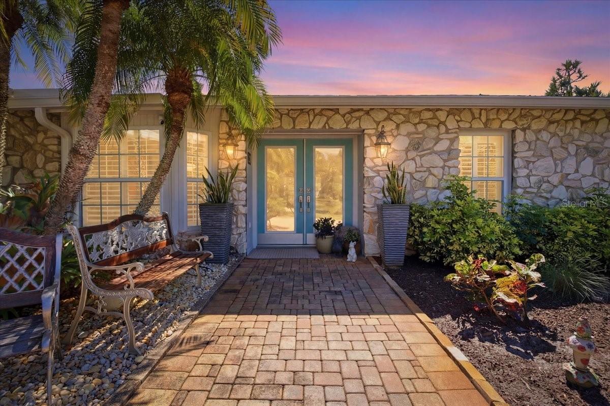 Have you always dreamed of owning a home with "backyard" access to your own boat and dock with easy access from the Intracoastal to the Gulf of Mexico-but thought it would be unattainable? The thought of hurricanes gives you pause? Well wish no longer-as this is the one that will be difficult to walk away from. Meticulously updated and maintained this 2280 sq. ft., 0.40 acre pie-shaped, fenced corner lot home lives much larger than its square footage and has never suffered any hurricane associated damage. With its bright and oversized rooms that draw you in to enjoy the indoor/outdoor all-season living that draws over 1000 people per day to make Florida their home you will delight in the "find" you can call your own. The outdoor lanai with heated swimming pool is surrounded lovingly tendered Florida mature plantings and leads to the pathway to your 2 year young replaced boat dock and access stairs. The boat lift can accommodate a vessel that is between 8000-10000 lbs. while the depth of the Lemon Bay Canal can handle a craft of up to 45 ft. The owners showed pride of ownership in the manner that the house was maintained. Newer roof, 2025 hot water heater with newer replaced dual zone A.C. units {2023 and 2025} and a generator hookup only ads to its worry free enjoyment. High impact windows and doors only reinforces the inclement weather-hardening of the home. The Owners did not stop there: Kitchen cabinets and counter-tops with a reverse osmosis system, appliances, laundry room with cabinets with utility sink, luxury CORTEC waterproof flooring, bathrooms remodeled and the popcorn ceilings were replaced with a texturized product. In addition the house had been re-plumbed in 2024 where the pipes have been run above the ceilings. There are two wells on the property. Only one is utilized for irrigation with a new freshwater connector switch. The den and family room share in a prominent custom-installed pass through fieldstone wood-burning fireplace which adds to the laid back ambience of the home and in particular the most used rooms in the home. The oversized garage is home to the owner's workshop when the "I can fix it" need comes up. Freshly painted, crown molding, French doors, plantation shutters throughout plus the new fans add to the crispness of the room presentations and the well thought out floor plan flow. Bringing the family?  After fishing swimming and boating there is an abundance of places to ride your bikes and enjoy the ride to the Lemon Bay Park just down the road.  *Don't miss this one. *It is worth your trip.