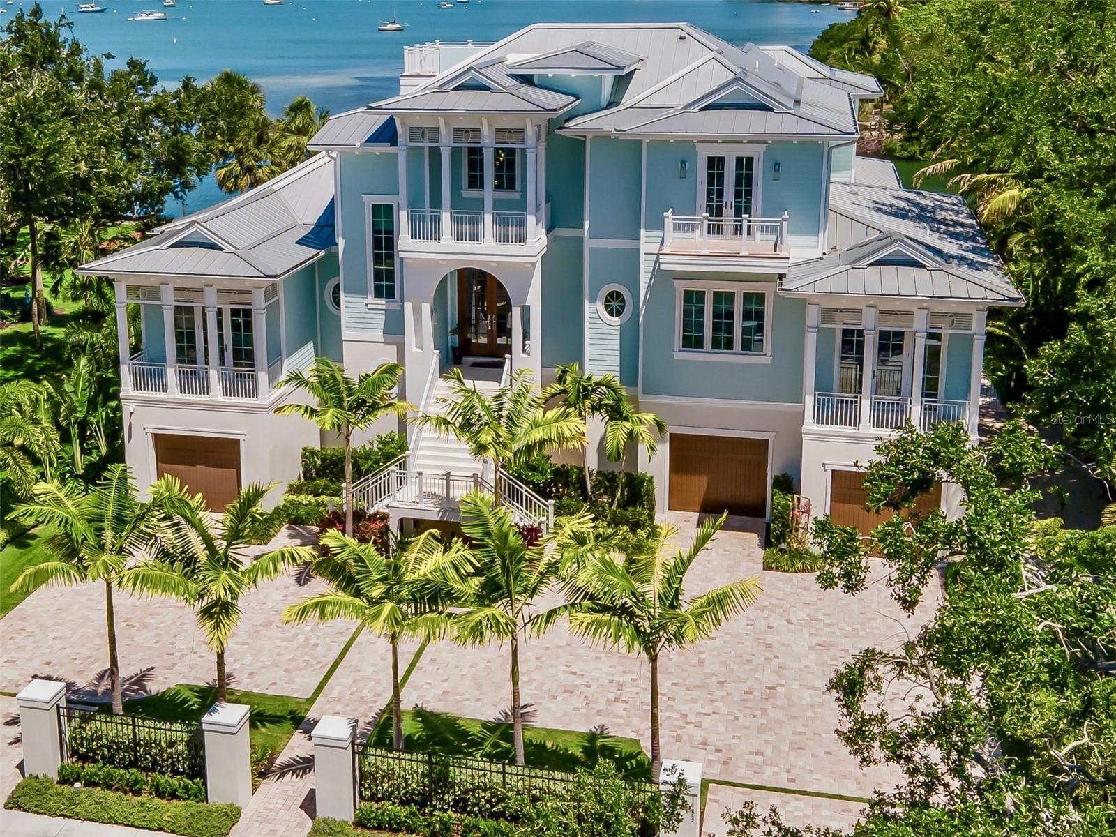 Pre-Construction. To be built. Looking to build BRAND NEW CONSTRUCTION with FULL BAY VIEWS in the fabulous Key Royale boating and golfing community? This 15,000 sq. ft lot has been fully cleared and is ready to go! The first photo is a proposed design by noted Sarasota designer Brian Phipps including building plans and pricing by local Sarasota builder. You can also bring your own plans and builder. Option to buy the vacant lot separately for $4,200,000. Plan specs: 5B/5.5B/+DEN with 4984 sq.ft and total of 11,321 sq.ft. and will include a 3 car garage, roof top deck, designer pool and spa and will feature high end builder upgrades for the most discerning buyers. Enjoy unobstructed views of the Tampa Bay and Sunshine Skyway.  Build your island dream home, or create a sensational waterfront investment property. Plans and elevations are available for your review. Floor plan, square footage, etc. have been calculated based on current design by local builder and can be shared on request.