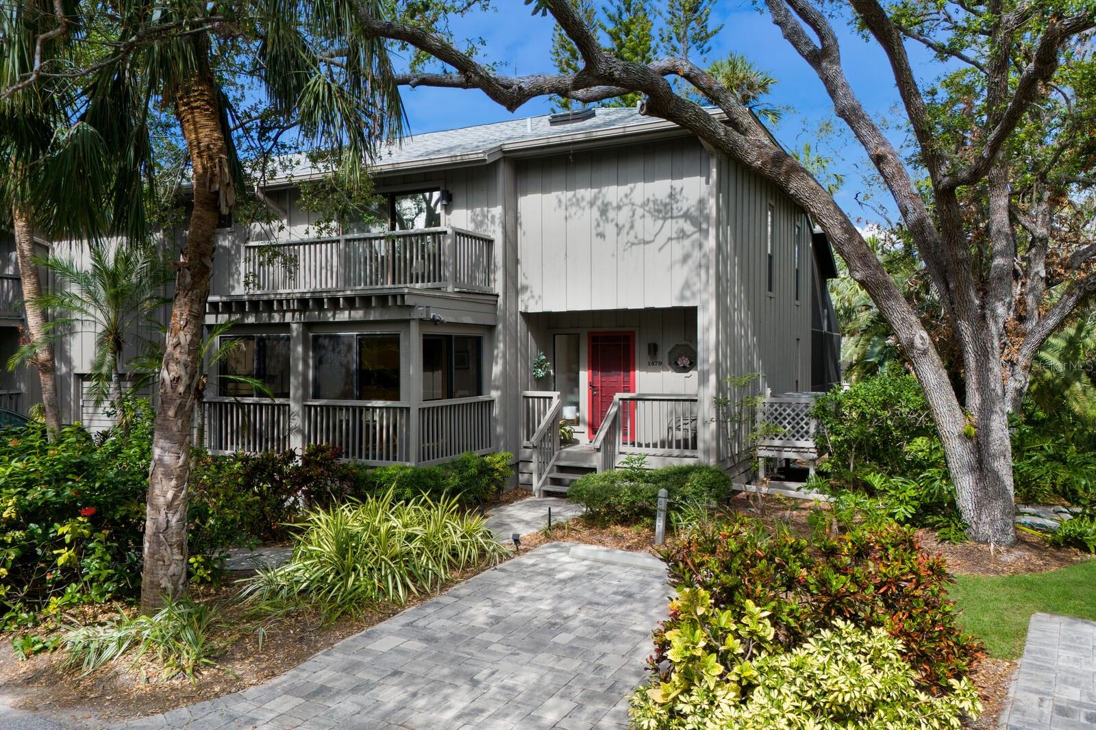 Escape to your own private retreat nestled amongst the trees in the desirable Landings Treehouse community! This stunning residence offers the perfect blend of modern elegance and comfort, just moments from Sarasota Bay and the area's beautiful beaches.

Relax on the expansive screened deck overlooking lush greenery, or step inside to discover a spacious 3-bedroom, 2.5-bath layout featuring vaulted ceilings, skylights, a custom arched window, and an updated wood-burning fireplace. The beautifully renovated kitchen boasts premium appliances, sleek countertops, and a cozy breakfast area with tranquil views from both sides of the home. Neutral tones and elegant tile flooring create a warm and inviting atmosphere throughout.

Upstairs, the spacious primary suite features high ceilings, a private balcony, and a fully renovated en-suite bath. Two additional guest bedrooms, each with its own balcony, share an updated bathroom. Enjoy the community's scenic tree-lined streets and nature trails leading to the Intracoastal Waterway, with optional membership available at The Landings Racquet Club, offering tennis, fitness, pool, spa, and social events. Conveniently located near shopping, dining, parks, and major highways.