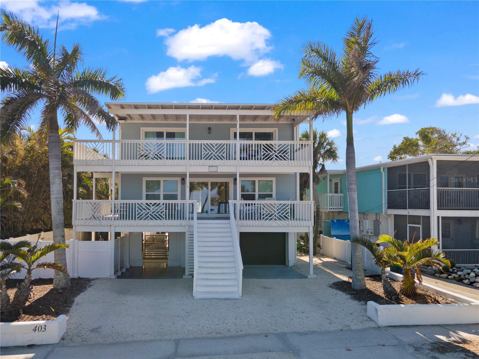 ANOTHER LARGE PRICE REDUCTION – MOTIVATED SELLER - Luxury Island Home on North End of Anna Maria Island - Bay Views - Skyway Bridge Views - Pool - Excellent Rental Income - Being Sold Turnkey - Welcome to exceptional island living on the highly sought-after north end of Anna Maria Island, where homes like this rarely become available.This beautifully maintained turnkey 4-bedroom, 3-bathroom coastal residence offers stunning sunrise views over the bay, an unbeatable location just steps from Bayfront Park, and easy access to a sandy beach and calm waterfront waters. This property is now one of the Best Priced investment or vaction home opportunites on Anna Maria Island. Enjoy your own fenced-in tropical backyard retreat, featuring: Private swimming pool with in-pool umbrellas, Lush, mature landscaping, Outdoor lounging and entertaining areas, Seamless indoor-outdoor island living.This Anna Maria Island luxury home features a bright, open-concept floor plan designed for entertaining and relaxed coastal living: Spacious living and dining areas, Large chef-style kitchen ideal for gatherings, and Wrap-around porches on multiple levels for bay breezes and water views, including nightly views of the lite-up Skyway Bridge. Two upstairs bedrooms open directly to the expansive second-floor porch, offering panoramic bay views and unforgettable sunrise beach views over the Bay. The oversized primary suite includes a spa-inspired ensuite bathroom with: Dual vanities, Large private soaking tub, Walk-in shower, and Luxury finishes throughout This Premier Island Location provides access to Walk, Bike, or Golf Cart Everywhere. Perfectly positioned near: Boutique shops, cafes, and ice cream parlors, waterfront dining and local restaurants, and the historic charm of the north-end of the island. Just minutes from the iconic Anna Maria City Pier, and easily accessible to Gulf beaches by golf cart or bicycle, this location defines true Florida island lifestyle living. This property is also a high-performing opportunity for investors:, Daily rentals permitted, Strong short-term rental demand on Anna Maria Island, and Ideal for luxury vacation rental income or second home use. Whether you are searching for a luxury waterfront home on Anna Maria Island, a high-income vacation rental property, or a private coastal retreat, this home delivers unmatched location, lifestyle, and value. Pack your bags and start living the Island Dream - Don't Worry - Bay Happy!