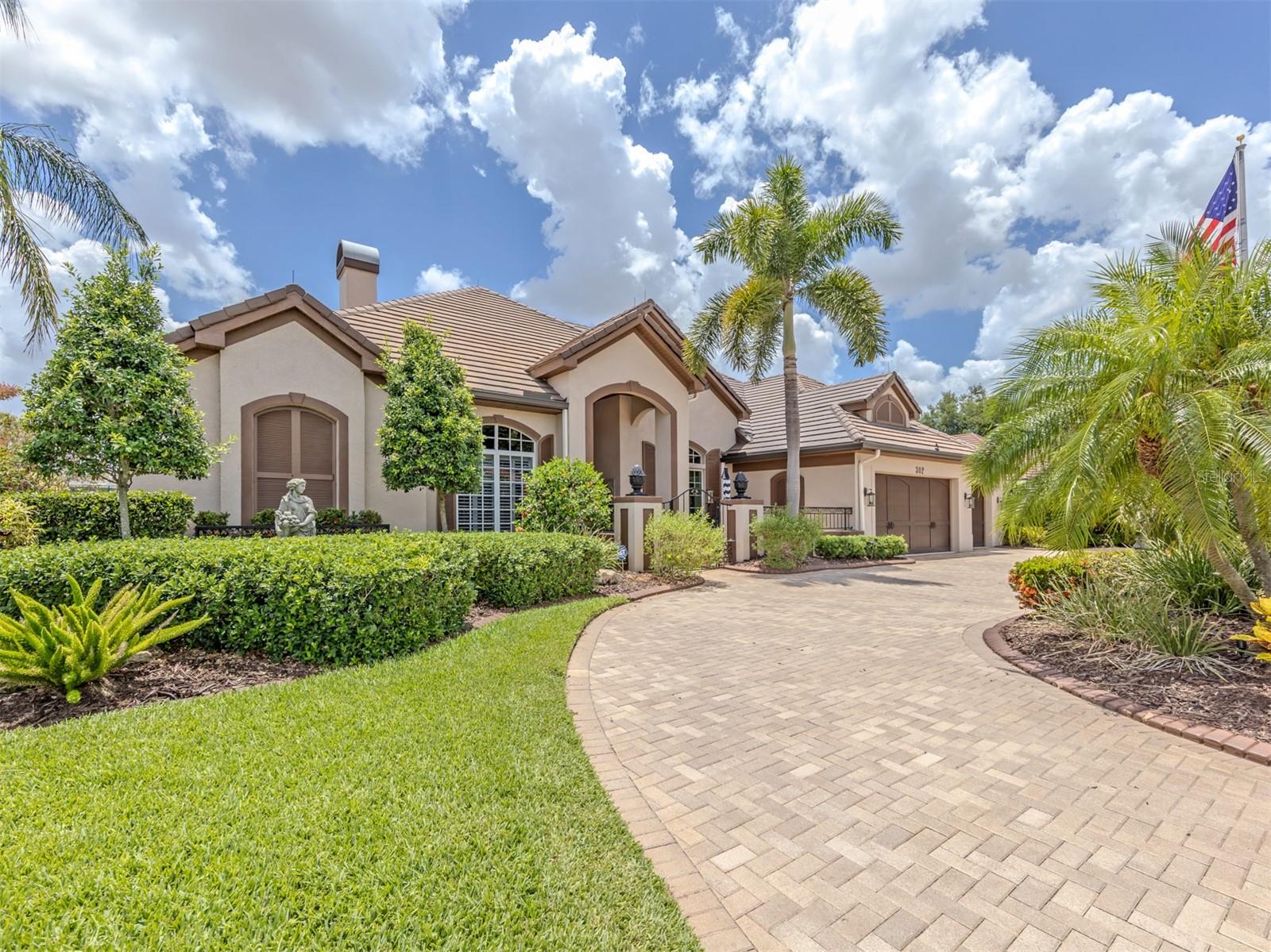 Perfectly within the gates of The Venice Golf and Country Club, this exceptional, best-of-the-best custom McGiffen-Shipps estate blends timeless elegance with luxurious comfort. A circular brick paver driveway and gated courtyard create a grand first impression, while soaring ceilings, crown molding, custom millwork and quality finishes define the thoughtfully designed split-bedroom floor plan. Showcasing a striking, exquisite fireplace and built-in niches, the living room opens to the spectacular lanai via a wall of sliders. A formal dining room, a private office with extensive custom built-ins and a spacious family room with a beverage center and wine storage add to the home’s impressive design. The gourmet kitchen is beautifully appointed with stone countertops, custom wood cabinetry, a large wraparound breakfast bar, a center island with a secondary sink, a walk-in pantry, double JennAir ovens, a Wolf microwave, a Miele cooktop, a wine refrigerator and a decorative tile hood. The luxurious primary suite is a private retreat featuring wood flooring, dual custom walk-in closets, designer finishes, intricate moldings and direct lanai access. The spa-inspired bath offers dual vanities, stone counters, a walk-in shower, a Safe Step soaking tub, linen storage and plantation shutters. Guest suites provide exceptional privacy and comfort for family and visitors alike. Outdoor living is nothing short of extraordinary. Arches and columns frame the expansive screened lanai with PebbleTec pool and spacious spa, summer kitchen, brick paver decking, outdoor fireplace, and outdoor shower, creating an unforgettable old-world ambiance ideal for entertaining or relaxing. A firepit patio is adjacent to the lanai as well. Additional highlights include an oversized air-conditioned three-car garage with a staircase going up to a huge storage area above, a spacious laundry room with dual refrigerators and custom storage, fresh interior and exterior paint, a new whole-house generator, a water filtration system, a new pool heater, a new hot water tank, updated fixtures, and numerous recent upgrades throughout. The Venice Golf and Country Club has been recently reimagined. The expanded clubhouse features a spacious gathering bar, gourmet and commercial kitchens and a cozy fire pit. Members enjoy casual and special event dinners throughout the year. The new state-of-the-art Wellness Center offers massage therapy, fitness classes, yoga, physical therapy and personal training that provide a holistic approach to health and well-being. The beautifully renovated Ted McAnlis-designed 18-hole championship golf course is treasured and highly rated as one of the best and well-maintained golf courses in the region. Residents also enjoy Har-Tru tennis courts, bocce ball and a junior Olympic-sized pool and spa, balancing active living with relaxation. As a Geo-Certified Audubon Cooperative Sanctuary, VGCC embraces environmental stewardship and sustainability. With an A+ financial rating, the community is as solid as it is serene. Ideally located just minutes from airports, shopping, dining, Interstate 75, cultural venues and Wellen Park is this charming home. It's also a short drive to the treasured Venice Island, where 14 miles of pristine beaches meet the sparkling Gulf Coast. Imagine your next extraordinary adventure at The Venice Golf and Country Club.