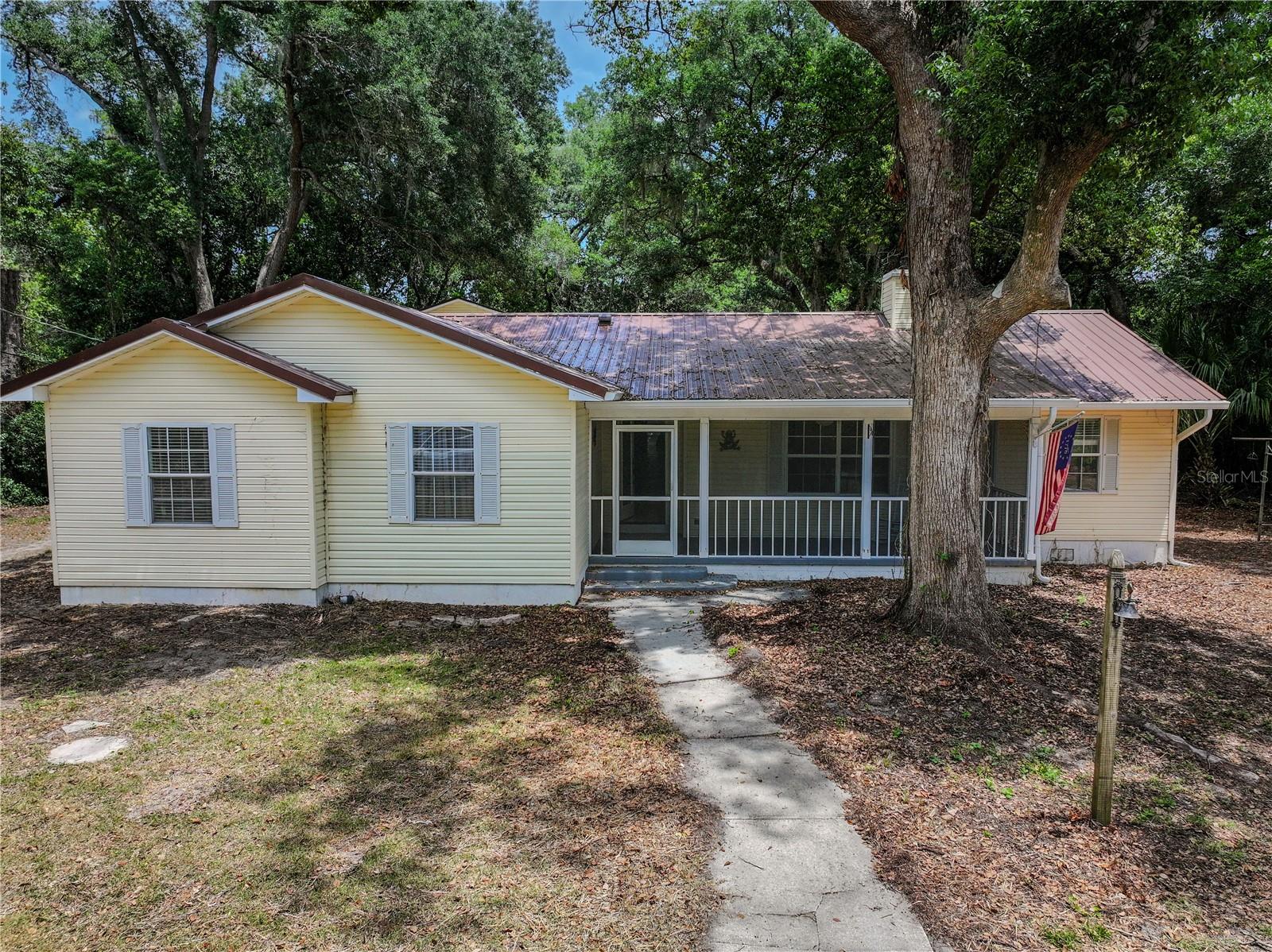Welcome to your private Florida retreat in the heart of Thonotosassa. Situated on nearly a full acre, this exceptional property offers the perfect blend of space, flexibility, and lifestyle with a beautifully maintained 4-bedroom, 2-bath main home, a detached oversized 2-car garage with a full 1-bedroom, 1-bath apartment above, and resort-style outdoor features that make everyday living feel like a vacation.

Step outside and enjoy your screened in-ground pool, ideal for relaxing or entertaining year-round. Need room for toys, tools, or travel? This property also features covered RV parking complete with a 50-amp power hookup, making it perfect for RV owners, travelers, or guests. Both the main home and detached garage are topped with durable metal roofs, offering long-term value and peace of mind.

The detached apartment adds incredible versatility for multigenerational living, guest accommodations, rental income potential, or a private home office setup. With nearly an acre of land, there’s room to spread out while still being conveniently located near Tampa, shopping, dining, and major roadways.

Properties offering this combination of acreage, pool, detached living space, RV accommodations, and flexible lifestyle opportunities are hard to find. Schedule your private showing today before someone else parks their RV here first.