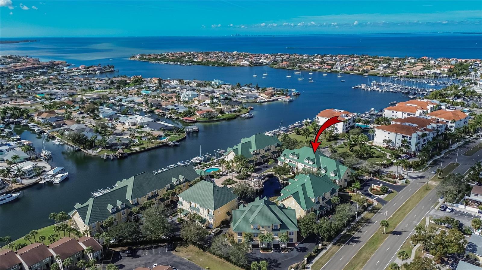 RENT THE HIGHER QUALITY, LOWER MAINTENANCE, FLORIDA WATERFRONT LIFESTYLE! This thoroughly renovated townhome towers 4 stories above the waterfront in the upscale boating enclave of Sunset Bay. Your life here can be truly easy -- not only because the 37-home association handles exterior work, water bills, pest control, flood insurance, and the exclusive residents pool beside the boat dock, but also because this unit has updated HVAC, LED lighting, stone counters, stainless-steel appliances, fresh paint throughout, and more. Nearly 3,100 SF, with a personal elevator in addition to stairs, includes 3 bedroom suites with 3 private baths plus a huge 4th-floor bonus of 2 rooms flexible for a 4th bed retreat, office, fitness center, entertainment loft, or whatever you may imagine. You'll find the kitchen, dining, and living rooms with a hallway lavatory on the 2nd floor, featuring a quartz-top dry bar in the dining area to complement the kitchen's quartz and wood style. These rooms with crown molding angle back toward a balcony porch looking southeast over the community's central pond. Like the balcony above it, part of the elegant 3rd-floor owner's suite, this sheltered outdoor space also boasts new tile, fans and screen. Below the balconies at ground level, an open 1st-floor porch with new epoxy floor gives you further options as well as a back door to the impressive garage, also newly epoxied. This garage is much larger than its single-wide overhead door suggests; it's a tandem design of more than 700 SF, the size of a 3-car garage, and it comes with internal side entry to the 1st-floor foyer, elevator, staircase and under-stair storage. A 3rd-floor washer/dryer closet, new window blinds, and a leaded-glass front door with sidelights are among other highlights here. Perhaps best of all, you're in Sunset Bay, a security-gated community with dock slips, deep-water canal access right beside the bay, and a great spot along Apollo Beach Boulevard near waterfront dining, shopping, services, recreation options, and easy routes up or down Florida's Gulf Coast! Ask about our risk-free rental application!