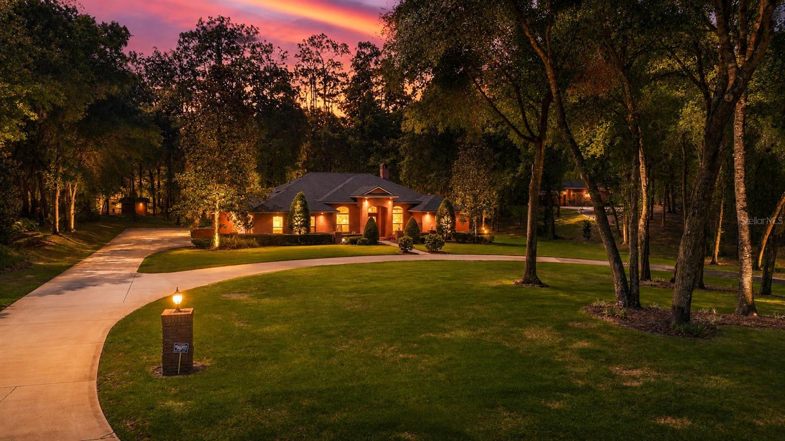 Tucked away on a quiet private street, this beautifully maintained one-owner brick home offers a rare combination of privacy, functionality, and exceptional outdoor living. From the moment you arrive, the impressive circular driveway and meticulously landscaped grounds create a welcoming first impression while providing ample parking for family, guests, boats, RVs, or recreational vehicles. Built for both comfort and entertaining, this spacious 4 bedroom, 2 bathroom residence has been lovingly cared for and thoughtfully updated, making it truly move-in ready.
Inside, you'll find a warm and inviting layout filled with natural light and timeless character. Double pane windows throughout the home provide energy efficiency while French doors add charm and seamlessly connect the indoor and outdoor living spaces. The spacious living and dining areas offer flexibility for everyday living and gatherings alike, while the home's thoughtful floor plan creates a comfortable flow perfect for both families and entertaining guests. Every space reflects pride of ownership and the quality of a home that has been exceptionally maintained over the years.
Step outside and experience your own private Florida retreat. The oversized screened porch creates the perfect setting for relaxing mornings, outdoor dining, or hosting friends year-round. Beyond the porch, the backyard has been fully landscaped and offers an abundance of space with plenty of room to design and build the pool of your dreams. An outdoor kitchen and outdoor shower elevate the outdoor experience even further, creating a backyard designed for entertaining and enjoying the Florida lifestyle to its fullest.
One of the standout features of this property is the impressive detached approximately 1,100 square foot garage, complete with its own separate driveway, electricity, and water. Whether you need additional storage, a workshop, space for hobbies, recreational vehicles, a home business setup, or future guest accommodations, this versatile structure offers endless possibilities. Major system updates provide additional peace of mind including a roof installed in November 2022 that remains under warranty, a well pump replaced in 2022, and an AC system that is less than five years old. This home has tinted PGT windows to help with energy costs as well!! Properties offering this level of care, space, flexibility, and outdoor amenities are truly hard to find.