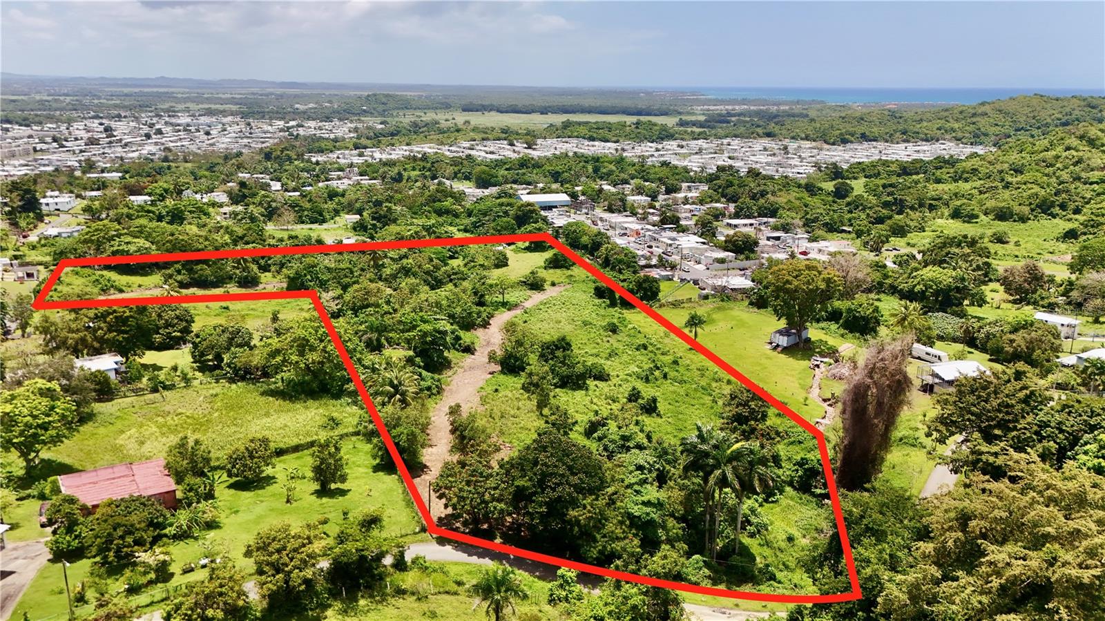 Discover 29,870 sm (approx. 7.6 acres) of FLAT LAND in Bo. Zarzal, Río Grande, offering the perfect canvas to build your dream home or develop a unique project in one of Puerto Rico’s most desirable regions. Ideally situated just minutes from the Wyndham Grand Río Mar Resort, Hyatt Regency Grand Reserve, and the world-famous El Yunque National Forest, with quick access to the golden beaches of Luquillo, Fajardo’s marinas, and ferries to Culebra and Vieques, this property combines natural beauty, convenient location, and development-ready terrain—making it ideal for a private estate, eco-tourism retreat, or sustainable investment.