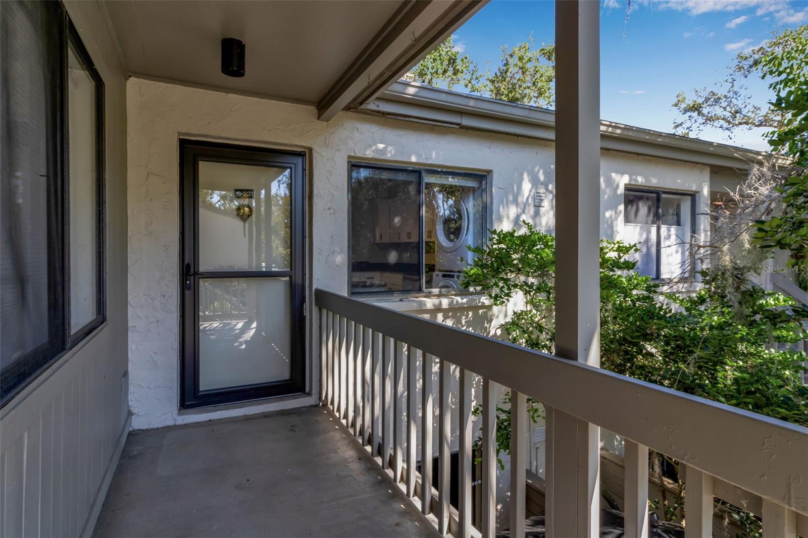 One or more photo(s) has been virtually staged. Experience the lush, tropical setting of Pelican Cove in this beautifully updated 1 bedroom, 1.5 bath corner unit, one of only nine in the entire community offering high ceilings and exceptional natural light. This corner unit lives larger than expected, featuring fresh paint, new carpet, stainless steel appliances, a full-size high-end stackable washer and dryer, plus a new water heater and new electrical panel for added peace of mind. Multiple balconies overlook vibrant foliage, creating a private and serene atmosphere that makes this home truly special. Conveniently located just steps from the carport and close to the heart of the community, the property offers easy access to Pelican Cove’s unmatched amenities. Set on 75 acres of botanical beauty, this gated waterfront community includes six swimming pools, lighted tennis courts, a fitness center, clubhouse, private harbor, kayak launch, and winding walking paths leading to peaceful views of Little Sarasota Bay. All of this, just minutes to shopping, dining, and Sarasota’s world-famous Gulf beaches.