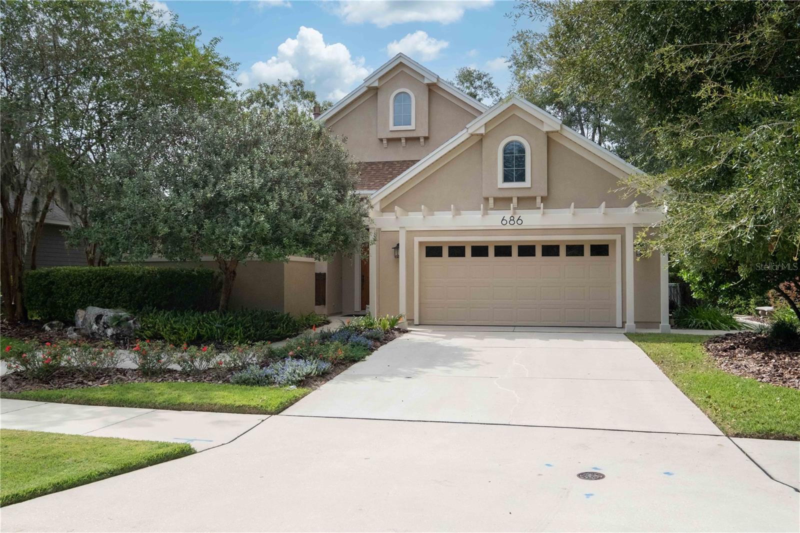 Brand new roof 2023!  Attention to detail throughout this beautiful custom built Bullard home with southwestern flair and architectural detail in Arbor Greens.  Features include charming walled private courtyard, welcoming  gallery entry with multiple niches for your art work, open gourmet kitchen with 6 burner gas cooktop, wine cooler, extraordinary amount of wood cabinetry, Kitchenaid stainless steel appliances, convection microwave,  granite counter tops.  Lovely tile flooring(no  carpet), separate dining room with plantation shutters,  gracious living area with two sided stone fireplace, vaulted tongue and groove ceiling, surround sound ,fireplace in primary bedroom.
Located on a quiet street with common area and open space in the backyard affording private charming beautiful views of nature. Serene backyard with meditation and labyrinth gardens.   This home has it all and has been beautifully  cared for. Move in condition.  HOA maintains the front yard!