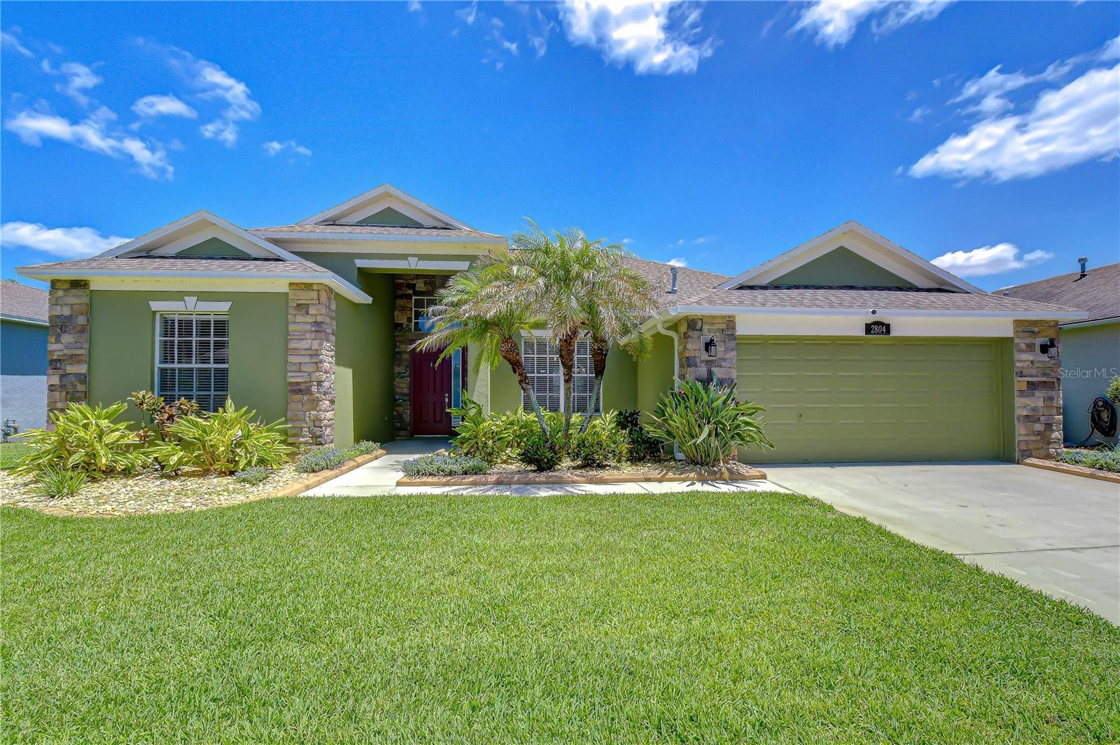 Welcome to this stunning, beautifully updated home located in the desirable Abbey Grove community in Valrico. This thoughtfully designed residence offers 3 bedrooms, 2 bathrooms, a split floor plan, and an abundance of natural light throughout. A welcoming entry features a formal dining room or flexible space that flows seamlessly into a spacious great room highlighted by a striking stone accent wall and sliding glass doors that open to the sparkling pool and expansive backyard. The kitchen is well-appointed with stainless steel appliances, generous counter space, and ample cabinetry for storage, along with a bright breakfast nook perfect for casual everyday dining. The spacious primary suite serves as a private retreat, featuring a comfortable sitting area, direct access to the lanai, dual closets, and a private en-suite bathroom. Two additional bedrooms are located on the opposite side of the home, providing privacy and sharing a full guest bath. This home has been meticulously maintained with numerous major updates, including a new hip gable roof (2022), HVAC system replacement (2023), 100-gallon gas water heater replacement (2024), and fresh interior and exterior paint (2026), offering peace of mind for years to come. Outdoors, the backyard truly lives up to the hype with a pavered lanai, a generous covered seating area, and a stunning saltwater pool built in 2016, featuring beautiful Midnight Blue PebbleTec® finish and custom waterline tile. The pool overlooks a large, fully fenced private yard framed by lush palm trees, creating the perfect setting for entertaining or relaxing. A storage shed adds extra convenience. Located in the heart of Valrico, Florida, Abbey Grove offers a peaceful suburban setting while still being conveniently close to everyday essentials. Enjoy easy access to shopping, dining, top-rated schools, parks, and major commuter routes, making it simple to reach Tampa, Brandon, and surrounding areas while still enjoying a quiet neighborhood feel. This home perfectly blends comfort, function, thoughtful updates, and exceptional Florida-style outdoor living.
