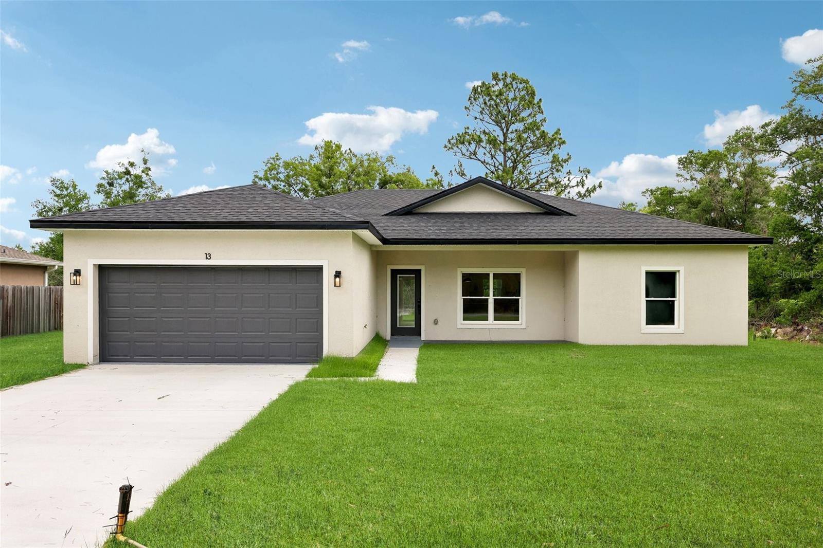 Brand-New Construction! Welcome to this beautifully crafted 3-bedroom, 2-bathroom home offering modern design, quality finishes, and comfortable living. Built in 2026, this move-in-ready residence features an open-concept floor plan, a spacious living and dining area, and a well-appointed kitchen with stylish cabinetry, ample counter space, and modern finishes. The primary suite provides a private retreat with an en-suite bathroom and generous closet space. Enjoy the convenience of a 2-car garage and a spacious lot with plenty of room for outdoor living and entertaining. Located in the growing community of Ocklawaha, this home offers easy access to Lake Weir, Ocala National Forest, The Villages, shopping, dining, and recreational activities. No HOA. Don't miss this opportunity to own a beautiful new home in a rapidly developing area of Marion County. Schedule your private showing today!