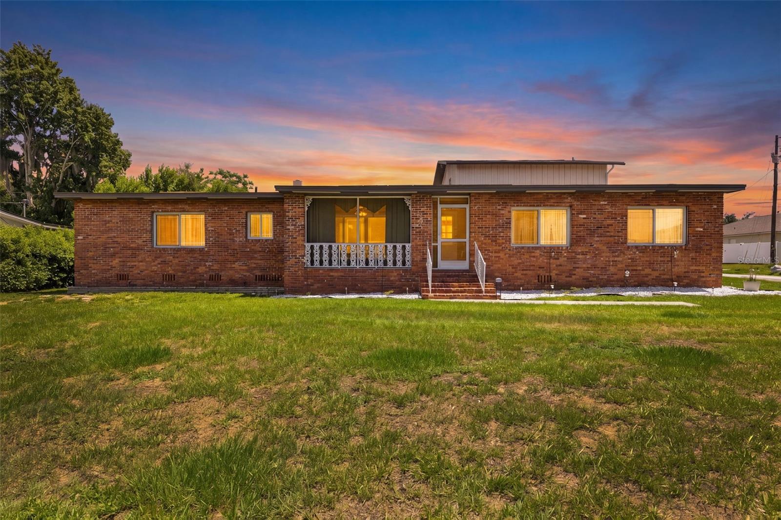 Welcome to this beautifully updated 4-bedroom, 3-bath pool home in the heart of Haines City! Offering a versatile floor plan, this home features multiple living and dining areas, a spacious family room, and an additional bonus room.

The updated kitchen boasts granite countertops, shaker-style cabinetry, stainless steel appliances, and a stylish subway tile backsplash. One of the home's unique features is the option of two primary suites—one on the first floor and one upstairs—making it ideal for multigenerational living, guests, or added privacy.

Enjoy Florida living year-round in the private screened-in pool overlooking the spacious backyard. Additional features include an indoor laundry room, a two-car garage, and a generously sized lot with no HOA.

Conveniently located near schools, shopping, restaurants, parks, medical facilities, and major highways with easy access to Orlando, Disney attractions, and Central Florida's many destinations. Move-in ready and offering the perfect combination of comfort, flexibility, and convenience—schedule your private showing today!