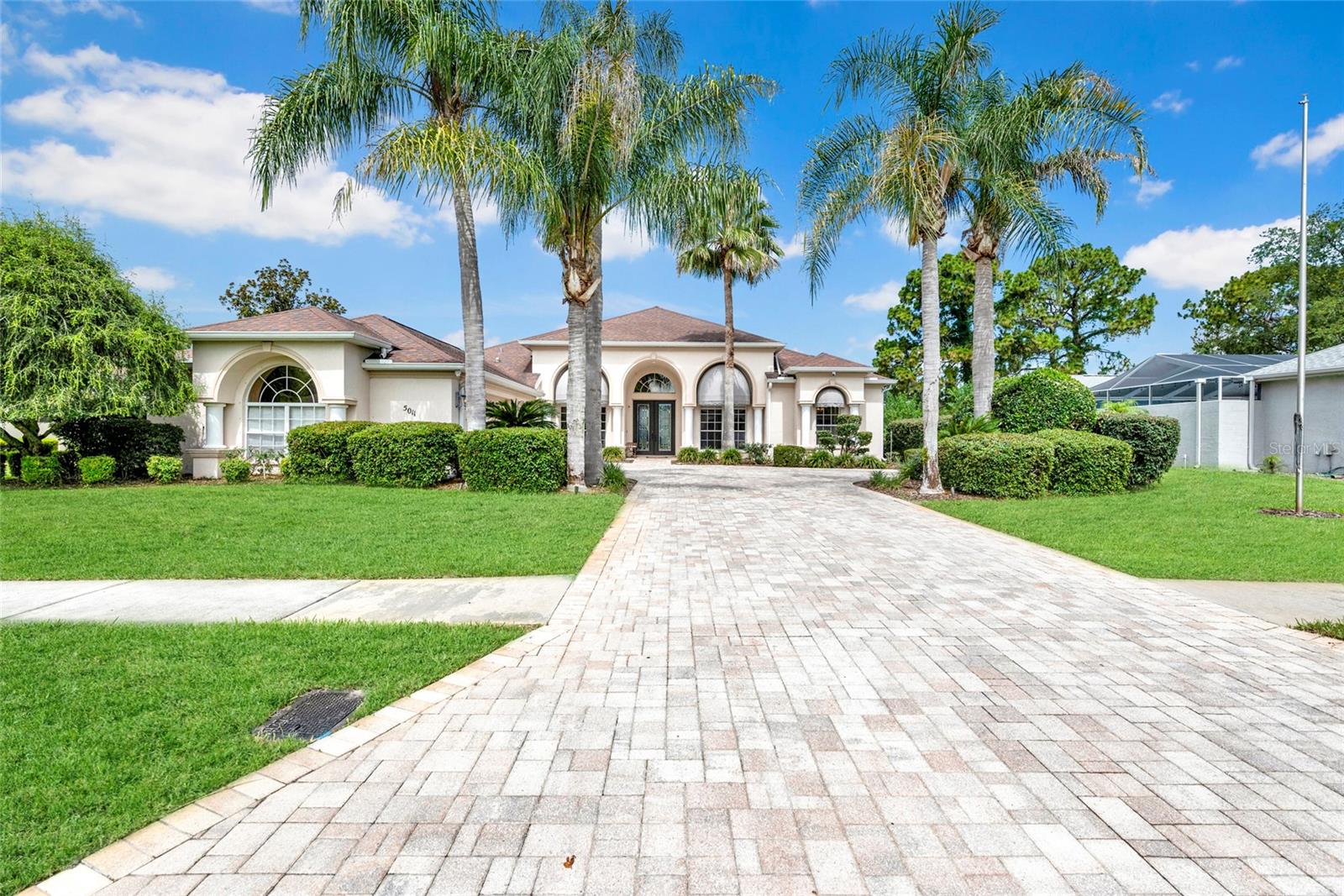This stunning turn-key home is move-in-ready! One-owner custom pool home overlooks the golf course in the highly desirable gated community of Silverthorn. Thoughtfully designed by a builder for his personal retirement home. This elegant home features a versatile 3-bedroom-plus-den (easily a 4th bedroom) split floor plan with 3 full baths and a massive 3-car garage. New carpet, paint & much more. READY for you to step inside the foyer to discover the open, light-filled layout boasting an expanded great room, formal dining area, and an updated kitchen. The heart of the home will not disappoint as it boasts stainless steel appliances, breakfast bar, pantry, and sunny nook for casual dining. The luxurious primary en-suite offers elegance with a walk-in closet, garden tub, separate shower, dual vanities, seated vanity, and private water closet (closed toilet room) The cozy den is located near the front entry with double glass French doors leading into a perfect home office. Additional highlights include a premium laundry room with cabinetry and new front-load washer/dryer, coated garage floors, and a newer HVAC system. Outside, enjoy the Florida lifestyle from the rear lanai overlooking the golf course via the birdcage screened pool area. Bring your best relaxing vibe as there is plenty of room to lounge, have get togethers and enjoy the open views and refreshing morning and evening breezes. Silverthorn’s resort-style amenities include a pool, fitness center, tennis and pickleball courts, clubhouse restaurant, community events, and a championship golf course—all conveniently located near shopping, dining, medical facilities, and the Suncoast Parkway. Nearby are award winning beaches, county parks, colleges, and well connected to interstates to all things Tampa, St. Pete, Orlando and booming central Florida! Make this classy home your own and live your best Florida dream lifestyle.