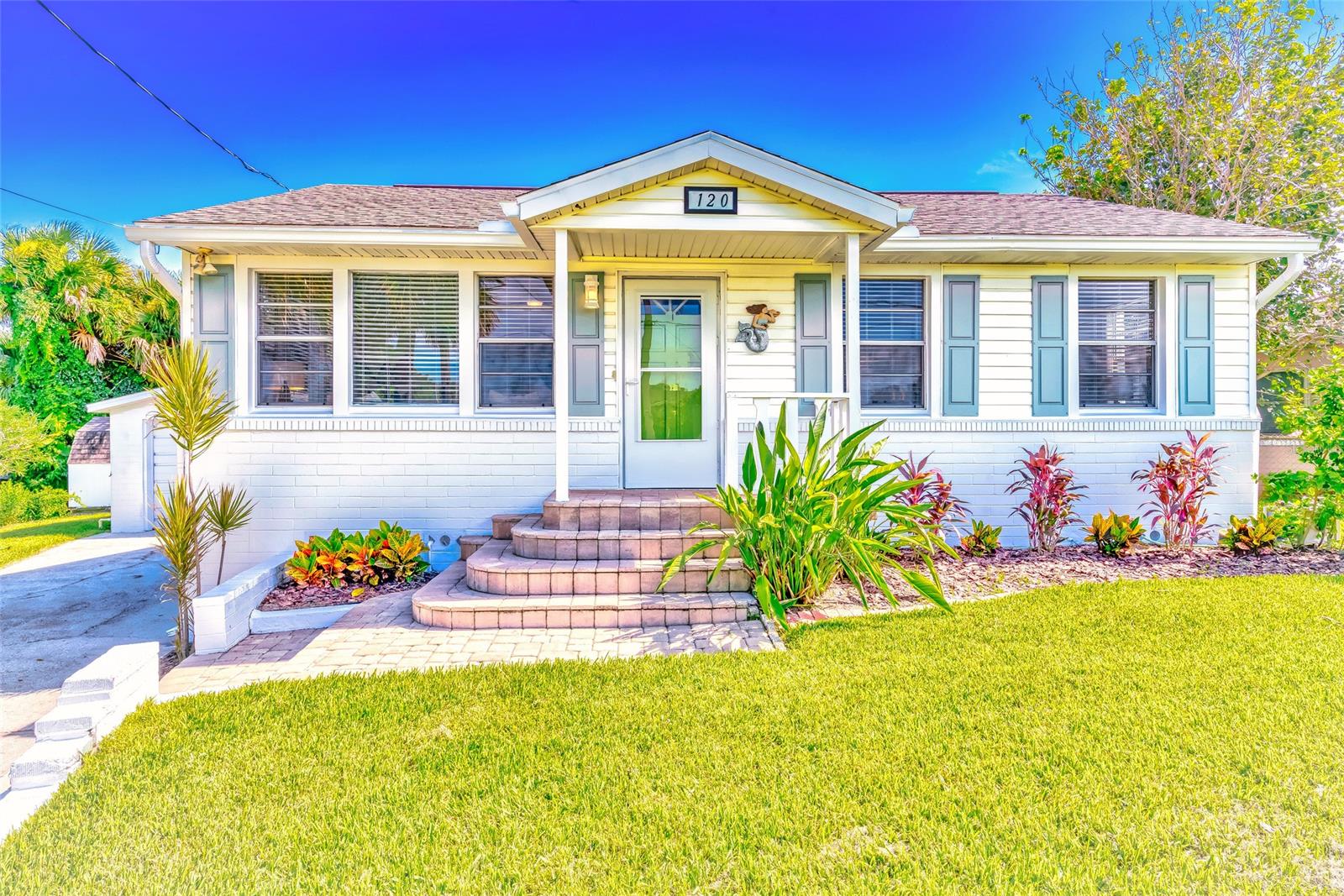 THE PERFECT VINTAGE HOME!! This beautifully modernized 1946 beachside home is the perfect mixture of new meets classic. The large windows wrapping around this home will engulf you in Florida sunshine making this charming bungalow delightfully bright. Only steps from world famous Daytona Beach your summer days will be filled with surf and sand and when you get home the spacious outside shower is the perfect way to de-sand and cool off! The luscious backyard is filled with tropical trees and a patio that is meant for barbecuing and dinner parties. The kitchen is newly updated with stainless steel appliances and lovely white cabinetry that match the original hardwood floors and bright interior stunningly. Whether you are looking for a weekend getaway or a place to call your forever home you will not find a more idyllic spot then 120 Bridgeport! Freshly painted interior and exterior, brand new kitchen and home appliances, AC 2016, roof 2013, and partially furnished. ;Water: City
