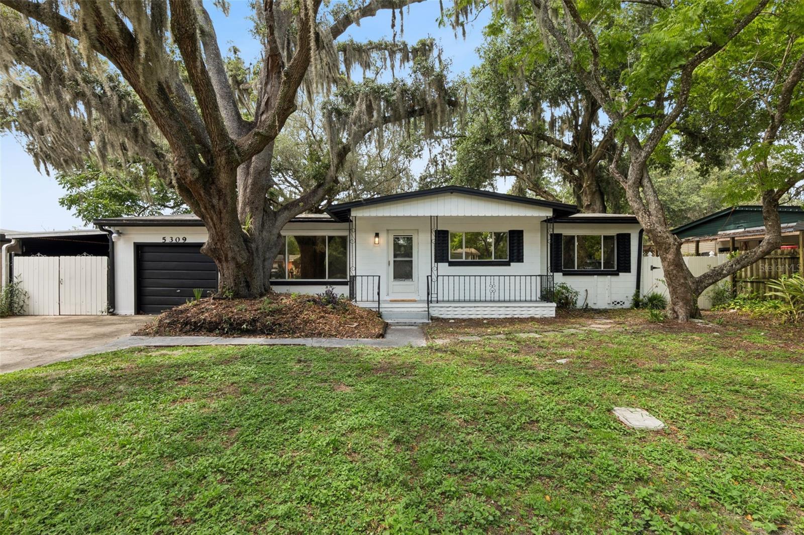 Welcome home to 5309 E. Kaley Street! This beautifully renovated bungalow sits on a spacious, fully fenced ¼-acre lot and features a large covered front porch perfect for relaxing and enjoying the Florida lifestyle.

Inside, you'll find wood-look tile flooring throughout, updated ceiling fans and light fixtures, and a thoughtfully renovated kitchen featuring white shaker cabinetry, granite countertops, and a complete appliance package. The home also offers updated bathrooms, a one-car carport, and a converted one-car garage that provides additional flexible living or storage space.

Major updates provide peace of mind, including a new roof (2021), new A/C system (2022), and kitchen and bathroom renovations completed in 2023.

Ideally located just minutes from the vibrant Hourglass District, you'll enjoy easy access to popular local shops, restaurants, and entertainment. Nestled in the desirable Conway area, this home offers convenient proximity to Downtown Orlando, Orlando International Airport, major toll roads, and is zoned for highly sought-after Boone High School.

Don't miss this opportunity to own a move-in-ready home in one of Orlando's most convenient and established neighborhoods!