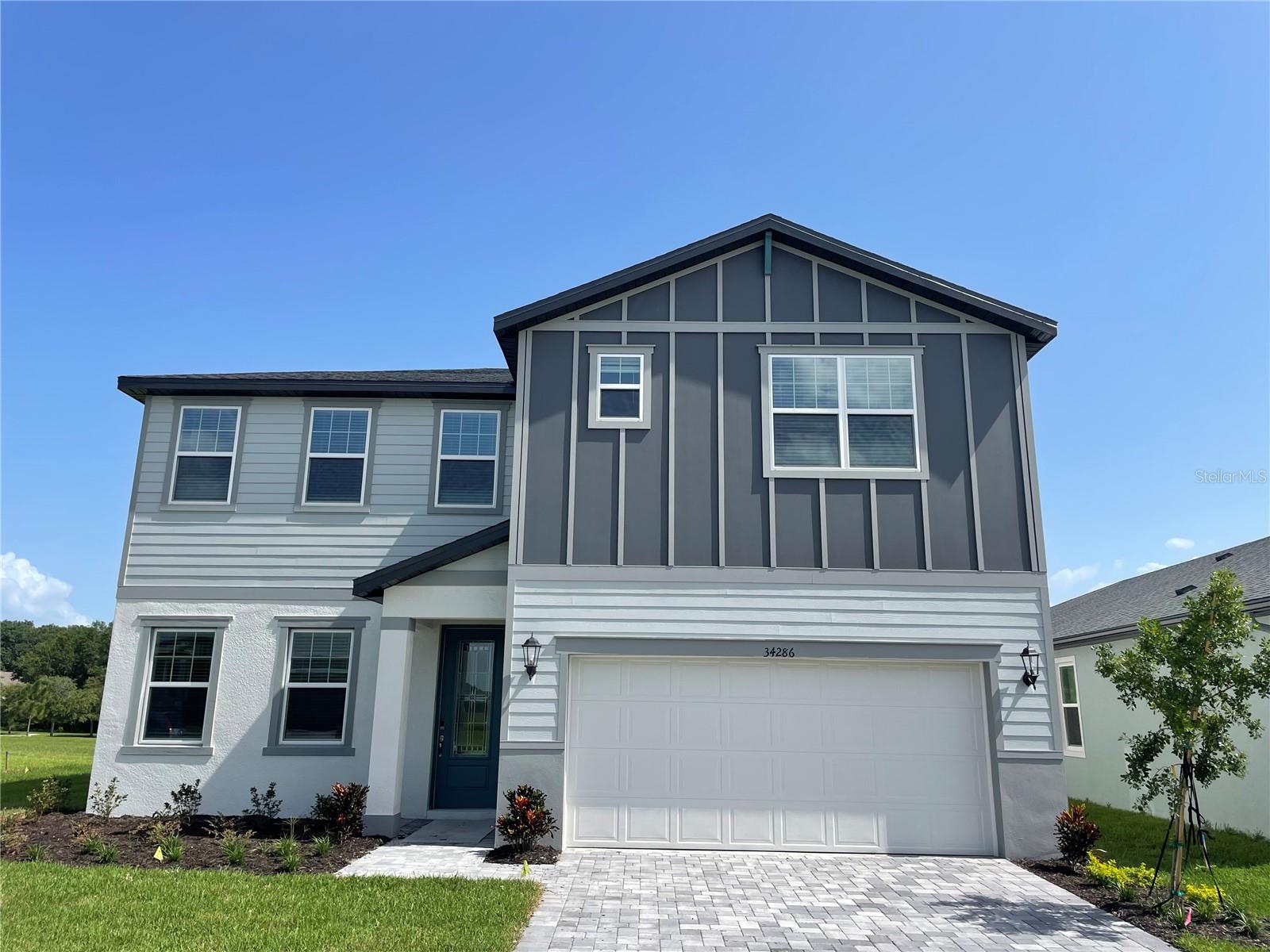Located in the Watergrass community of Wesley Chapel, this residence offers approximately 2,830 square feet of living space with 4 bedrooms, 3 full bathrooms, a 2-car garage, and a 2-car driveway. The home features covered front and rear porches and a functional open-concept layout designed for everyday living and entertaining.

The kitchen overlooks the family room and includes quartz countertops, a marble backsplash, a spacious center island, and upgraded appliances. The open living areas provide flexibility for gatherings and daily use.

The home offers well-sized bedrooms and multiple full bathrooms to accommodate a variety of living arrangements.

Watergrass residents enjoy access to community amenities including multiple swimming pools, tennis courts, fitness center, pavilion, playgrounds, and walking areas throughout the neighborhood.

Conveniently located near I-75, the property provides easy access to shopping, dining, medical facilities, and entertainment destinations including Tampa Premium Outlets, The Shops at Wiregrass, and KRATE at The Grove. Nearby schools include Watergrass Elementary, Kirkland Ranch Academy of Innovation, and Innovation Preparatory Academy.

This property offers a combination of space, updated finishes, and community amenities in the Wesley Chapel area. Schedule your private showing today.