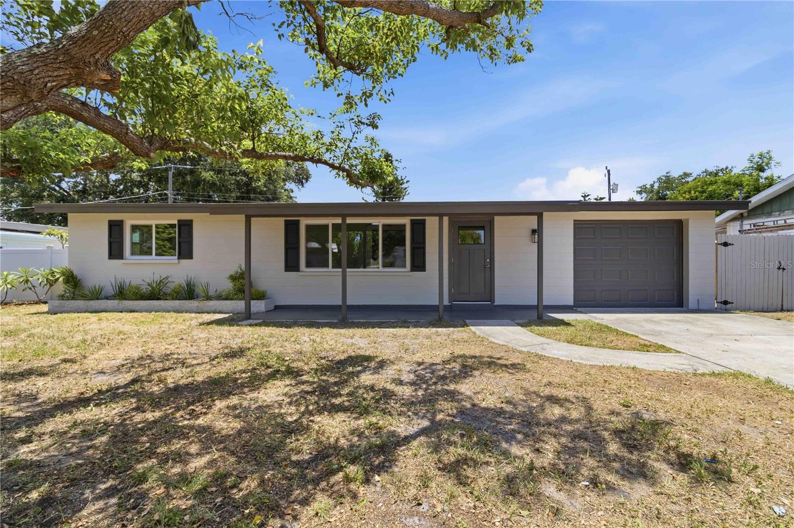 Welcome to this exceptional West Bradenton sanctuary, where luxury and freedom blend seamlessly! This fully remodeled 3-bedroom, 2-bath home features a flexible bonus room, perfect as a fourth bedroom or office. A 2024 roof and 2024 windows offer peace of mind, while brand-new central air conditioning and two 2026 mini-split units ensure perfect climate control. The kitchen is a showstopper, featuring gleaming granite countertops, high end dark shaker cabinets, and stainless steel appliances. Both bathrooms have been meticulously upgraded with fully tiled shower and bath tub combo, elegant vanities, and designer finishes. Not to mention, the entire house has been re piped as well. Plus, a brand-new 2026 water heater ensures efficiency. Freshly painted inside and out, the home also offers a sprawling, fully fenced backyard. And best of all—no HOA, no deed restrictions! Located close to downtown, SRQ Airport, and West Bradenton’s finest, this is the extremely affordable move in ready home that needs absolutely nothing and truly has it all.
