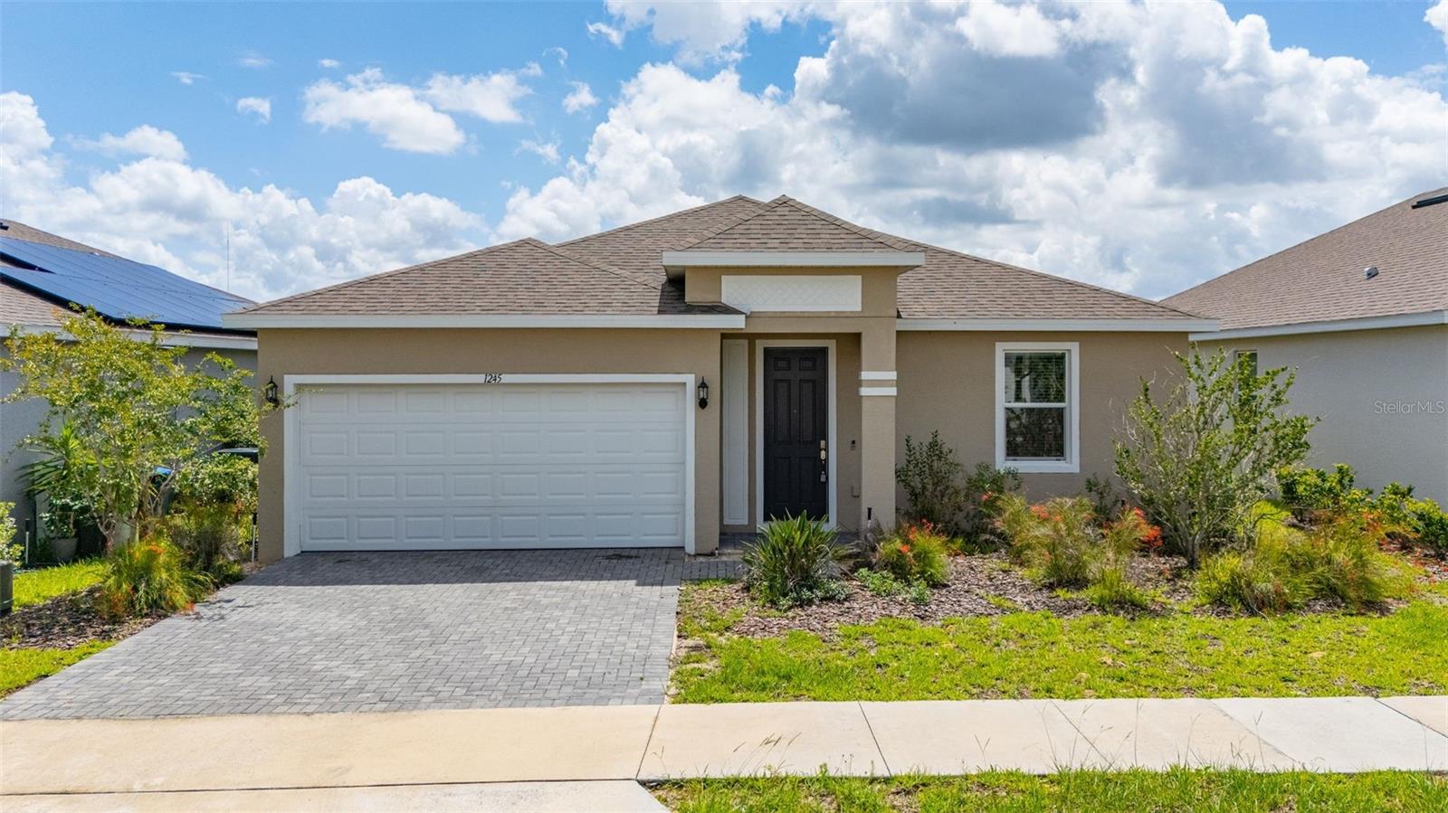 Virtually Staged. Welcome to Cypress Park Estates in Haines City! This beautiful 3-bedroom, 2-bath excite floor plan offers a bright, open layout with 9'4" ceilings and plenty of natural light throughout. As you enter, ceramic tile flows through the main living areas, with carpet only in the bedrooms for added comfort.

The kitchen features 42" upper cabinets, granite countertops, stainless steel appliances, a spacious island with sink, and ample storage space, making it both functional and inviting. The primary suite includes a walk-in closet and private en-suite bathroom. Additional features include a brick paver driveway, window treatments on all windows, a 16 SEER A/C system, and smart home technology.

Cypress Park Estates is a master-planned community located in Haines City, one of Polk County’s largest and most convenient locations. Residents enjoy easy access to beautiful lakes, golf courses, sports venues, shopping, dining, grocery stores, and LEGOLAND Florida. Community amenities include a large resort pool with cabanas, fenced in playground, and a fenced in dog park.