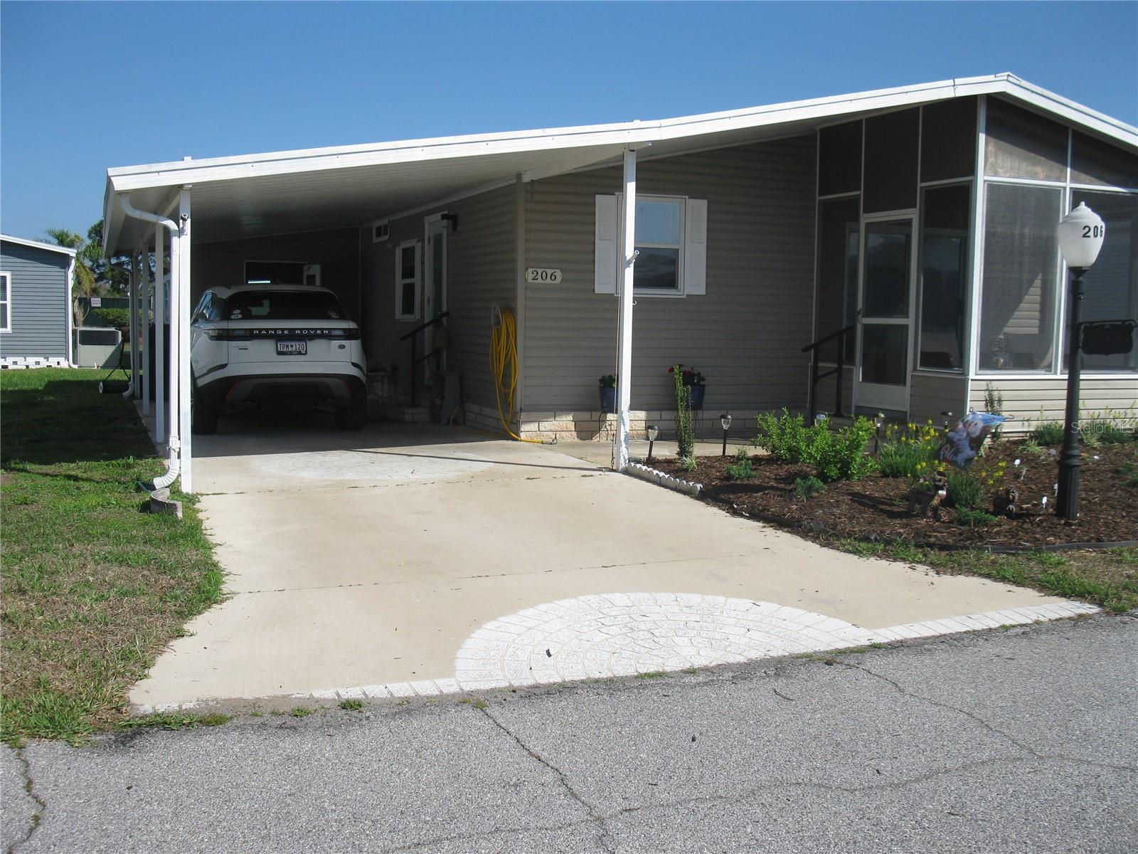 This cutie is a Turn Key property.  Completely remodeled, everything updated, all new kitchen with stone counters and baths, all new floors, windows, roof, A/C, new duct work, new plumbing, updated Electric.  Entire home furnished and nicely decorated.  Even the laundry center has been redone with built in cabinets, etc.  The Screened in Porch is comfortable with nice wicker furniture and new floor covering.  Nicely landscaped also.   You don't have to do anything except bring your personal belongings.  This is a rare gem in a Golf and Tennis Community that is full of amenities for a resort lifestyle.  Enjoy fishing or boating from our marina on Lake Henry, Play Tennis or Pickle ball on the Tennis and Pickle Ball courts, how about horse shoes of Bocci Ball.  We have a large Clubhouse with Billiards, craftroom, Ballroom, Library and a full service Pub.  Enjoy shows, dances, dinners, Bingo and many activities to keep anyone as busy as they want to be.  See us first.  Call for a Tour.