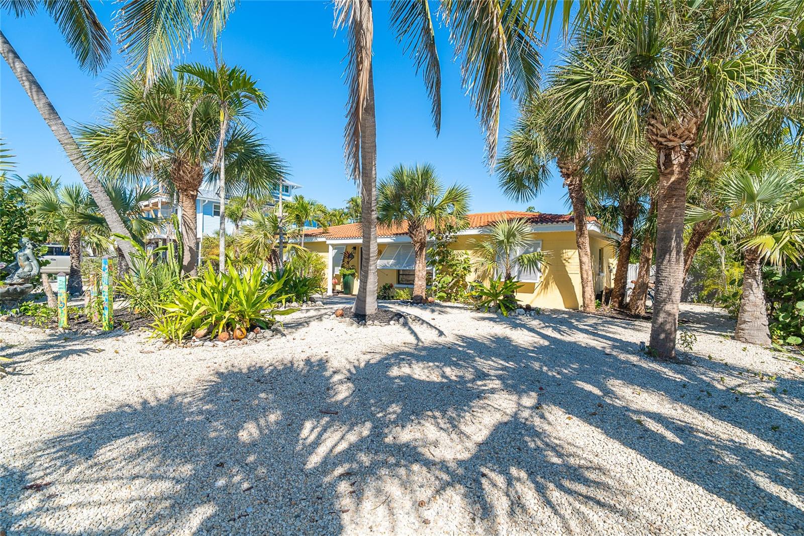 You will fall in love with this adorable 3 bedroom 2 bath cozy home that is loaded with charm and beautiful art.  Tropical swimming pool setting that makes you feel as if you are on vacation in the Caribbean...with no set date to leave!!  Deep water dock with direct and quick access to the Intracoastal Waterway. This home combines the unique blend of old world character with it's arched entrances and all of the modern, convenient amenities.  Not your cookie cutter beach house, it is a home with a soul.  Rare opportunity to own on the ground level with only one floor for those who cannot or do not want to deal with stairs. The home underwent a complete, whole house renovation in 2025 as follows: new plumbing and electrical ground connections, interior walls, flooring,  appliances, deck and screening, granite countertops in kitchen, wood cabinets, bathrooms, lighting, pool equipment, interior paint and full irrigation system.  All new Tommy Bahama look furnishings throughout with fully stocked kitchen and additional supplies for a rental property.  There is quite a bit of island  themed art from several artists that will remain depending on the agreed upon sale price on the property.  Otherwise, turn key to the new owners.  Rental information upon request.  Don Pedro-Knight-Palm Island is a bridgeless, barrier island situated between Sarasota/Tampa to the north and Ft. Myers/Naples to the south.  Accessible only via a private boat or 4 minute car passenger ferry ride. Buy your piece of paradise and live the serene island life.  Enjoy walking the beach collecting shark's teeth  and shells, glorious sunsets, fishing, boating, kayaking, paddle boarding, biking and breathing in the salt air.  There is nothing better ......