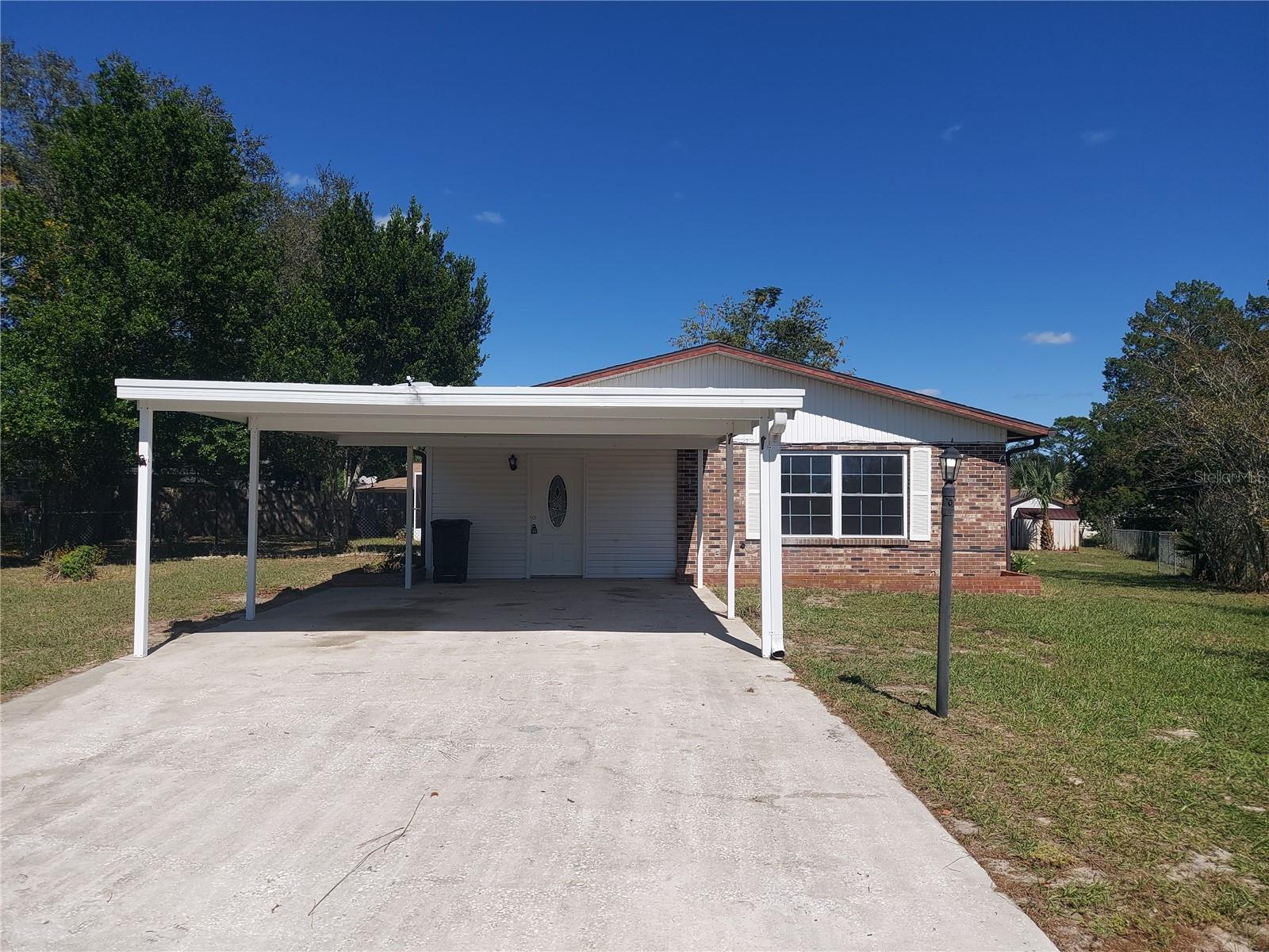 TWO BEDROOM TWO BATH POOL HOME IN SILVER SPRINGS SHORES. HOME IS FRESHLY PAINTED AND FEATURES OPEN LIVING AND DEN,  KITCHEN, TILE AND LAMINATE FLOORING, LARGE MASTER BEDROOM, DINING ROOM THAT COULD BE USED AS THIRD BEDROOM, CARPORT, SCREENED POOL, AND LARGE BACKYARD WITH STORAGE BUILDINGS.