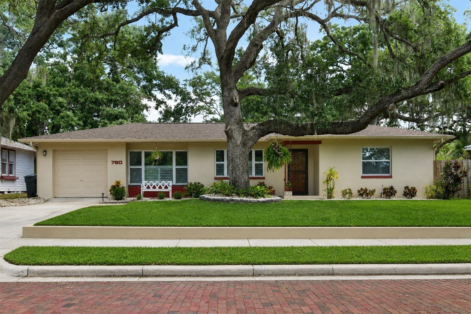 One or more photo(s) has been virtually staged. Pride of Ownership and Close to Downtown Location! This Beautifully and Extensively Updated Mid-Century home in Move-In-Condition is located on a charming brick street and only a short walk to downtown Dunedin. Upon entering you’ll love the openness of the floor plan, the newer flooring and the split bedroom layout. The updated eat-in kitchen features Newer Wood Cabinetry, Quartz Counter Surfaces and Stainless Steel Appliances. The master bedroom is large enough to accommodate a king-sized bed and furniture. The secondary bedrooms are ample sized as well. The Kitchen opens to a separate den/office and a 15 x 21 enclosed Lanai with a newer (included) Hot Tub.  The oversized (.21 acre) lot features a spacious backyard which will accommodate a future pool or addition. The garden area is perfect for outdoor entertaining with Mature Trees for Shade and a 6" privacy fence. Upgrades include Newer Roof, Windows & A/C. Not in a flood or evacuation zone. No HOA or CDD.