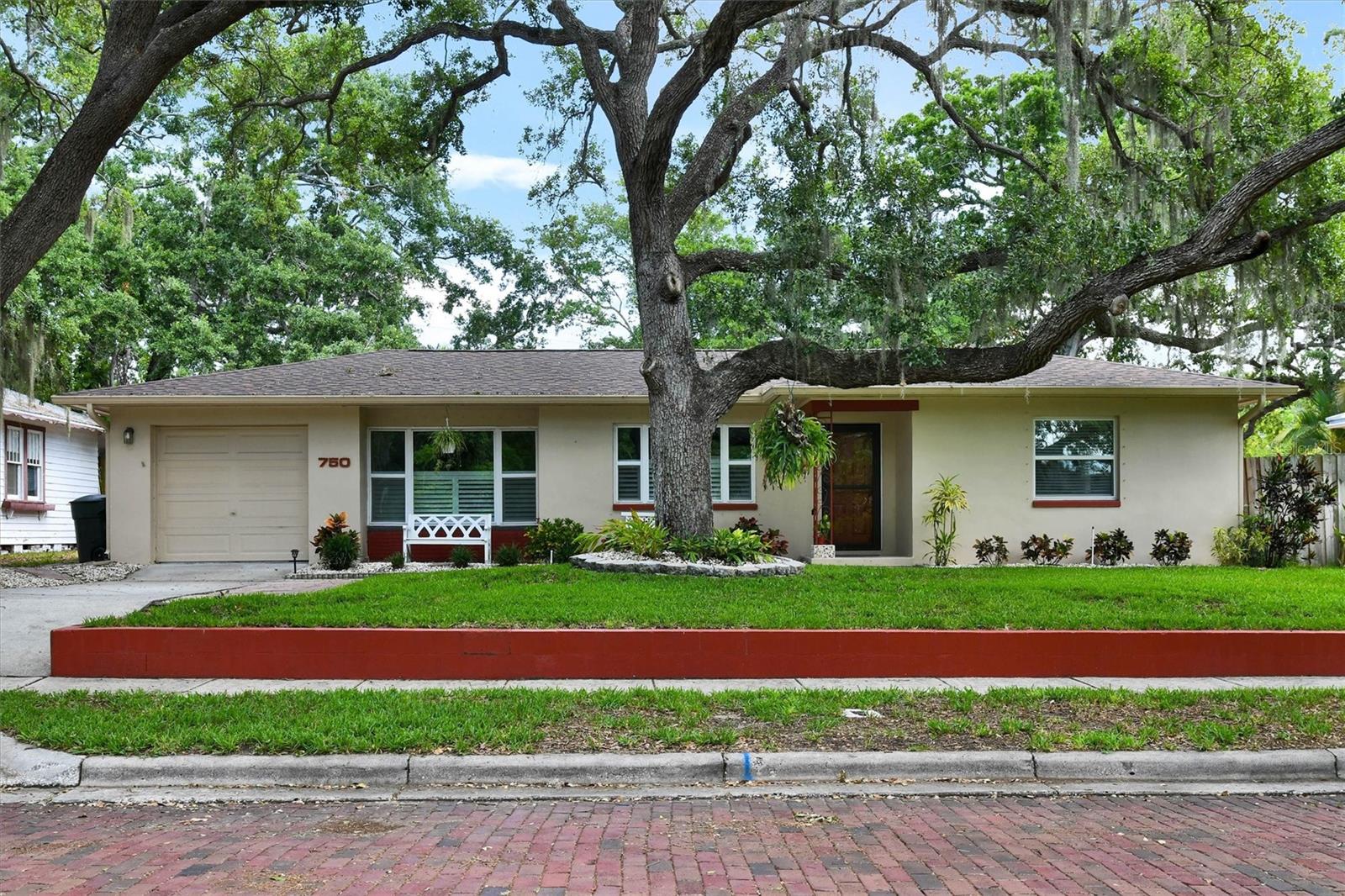 Major Price Reduction! Pride of Ownership and Close to Downtown Location! This Beautifully and Extensively Updated Mid-Century home in Move-In-Condition is located on a charming brick street and only a short walk to downtown Dunedin. Upon entering you’ll love the openness of the floor plan, the newer flooring and the split bedroom layout. The updated eat-in kitchen features Newer Wood Cabinetry, Quartz Counter Surfaces and Stainless Steel Appliances. The master bedroom is large enough to accommodate a king-sized bed and furniture. The secondary bedrooms are ample sized as well. The Kitchen opens to a separate den/office and a 15 x 21 enclosed Lanai with a newer (included) Hot Tub.  The oversized (.21 acre) lot features a spacious backyard which will accommodate a future pool or addition. The garden area is perfect for outdoor entertaining with Mature Trees for Shade and a 6" privacy fence. Upgrades include Newer Roof, Windows & A/C. Not in a flood or evacuation zone. No HOA or CDD. Hurry! This home will sell fast at this price!!