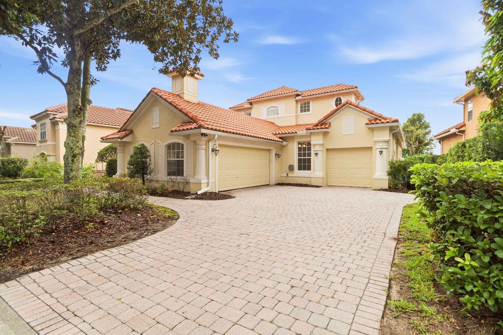 Virtually Staged. Rare opportunity to own a spectacular lakefront home in the exclusive 24-hour guard-gated community of Vizcaya, perfectly positioned on a pristine lakefront homesite in the heart of Orlando's renowned Restaurant Row. This stunning 5-bedroom, 3-bath pool home with a 3-car garage offers breathtaking water views and the perfect blend of luxury, comfort, and elegance. New roof (2022) and AC system (2015). From the moment you enter through the grand double doors, you'll be captivated by panoramic lake views that create a stunning backdrop throughout the home. Designed for both everyday living and entertaining, the open and light-filled floor plan features spacious living and dining areas, soaring ceilings, and seamless indoor-outdoor living. The gourmet kitchen boasts modern appliances, abundant cabinetry, a center island with breakfast bar, and a breakfast nook overlooking the sparkling pool and tranquil lake. The thoughtfully designed layout includes three bedrooms on the main floor, including a luxurious primary suite with lake views, a spacious walk-in closet, dual vanities, a garden tub, and a separate shower. Upstairs, you'll find two additional bedrooms and access to a private balcony, perfect for enjoying peaceful lake views and spectacular sunsets. Step outside to your private waterfront oasis, where a sparkling pool and spa overlook the lake, creating the ideal setting for relaxation and entertainment. Enjoy year-round outdoor living and watch Disney Magic Kingdom fireworks from your backyard. Vizcaya residents enjoy resort-style amenities including a lakefront clubhouse, community pool and spa, fitness center, tennis courts, walking paths, playground, and dog park. Conveniently located near Restaurant Row and just minutes from I-4, Orlando International Airport, world-class shopping, dining, and attractions. This is a rare lakefront retreat offering luxury living in one of Orlando's most sought-after communities. Schedule your private showing today.