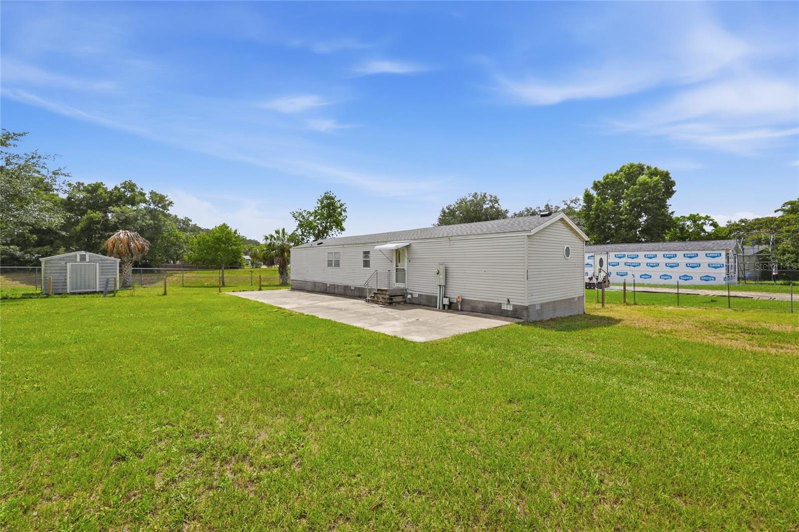 Welcome to this well-maintained 2-bedroom, 2-bath home offering comfortable living in a peaceful Ocala setting. Featuring a newer roof and newer HVAC the big-ticket items are already taken care of, this move-in-ready home provides added value and peace of mind from day one. Inside, you'll find a spacious open-concept living area, well cared for vinyl and carpet, a large kitchen with abundant cabinetry, generous counter space, and a center island that's perfect for meal prep or casual dining. The split-bedroom floor plan offers added privacy, while the primary suite includes an ensuite bath and ample closet space.

Step outside to a spacious rear deck overlooking a backyard that backs up to peaceful green space, creating a private setting with no immediate rear neighbors. The outdoor space also features a storage shed for extra storage and a large concrete patio, making it the perfect place for entertaining, grilling, or relaxing with family and friends.

Conveniently located just minutes from shopping, dining, medical facilities, and everyday conveniences, with easy access to downtown Ocala, Silver Springs State Park, and major roadways for an easy commute. Whether you're a first-time homebuyer, downsizing, or looking for an investment opportunity, this well-maintained home offers the perfect combination of comfort, convenience, and privacy.