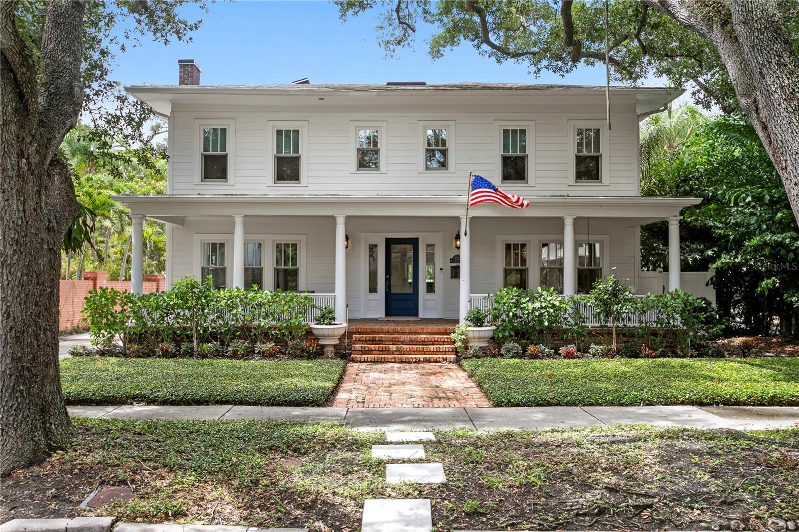 Set along one of Tampa's most admired streets in the highly sought after New Suburb Beautiful neighborhood, this completely updated, turnkey residence blends timeless charm with elevated modern finishes. A gracious front porch, elegant formal living and dining spaces, and a gourmet kitchen featuring Sub-Zero and Wolf appliances create a sophisticated setting for both everyday living and entertaining.

The thoughtfully designed floor plan features a luxurious primary suite with expansive his-and-hers walk-in closets and luxurious en suite bath. Two additional bedrooms share a beautifully appointed full bath with a double vanity, while an additional en suite bedroom provides ideal accommodations for guests or multigenerational living.

The private backyard has been transformed into a true outdoor oasis with a brand-new pool and low maintenance turf, offering the perfect space for relaxing or entertaining year round.

A rare pass-through four-car garage with front and alley access is complemented by a newly remodeled coach house apartment above, complete with kitchen, living room, bedroom, and full bath ideal for guests, extended family, or a home office.

Positioned in one of South Tampa's most coveted neighborhoods, with highly rated schools this exceptional home offers refined living, outstanding functionality, and unmatched versatility in a premier location.