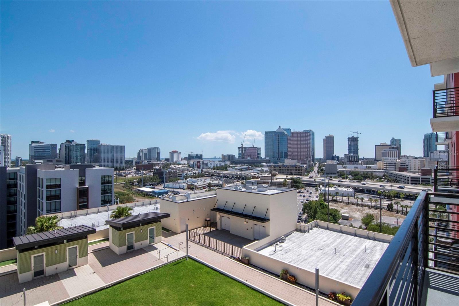 Fantastic 12th floor ideal Sienna Floorplan home with a large balcony boasting panoramic views of Channel District, Water Street, and Downtown Tampa Skyline. INCLUDES TWO RESERVED PARKING SPACES AND CLIMATE-CONTROLLED STORAGE UNIT. Beautiful 2 bedroom/2 bathroom floorplan. Equipped with gas range, oven, and dryer as well as NEW Viking stainless steel refrigerator, dishwasher, and microwave. Downstairs retail includes Crunch Fitness & Gym, Dry cleaners, Pourhouse beer bar, Gingerbeard coffee, Massage Envy, and additional retail. One block to the Channel District Publix. Amenities include 9th floor pool, spa, fitness, clubroom, green space, grills, and concierge. At Grand Central condominiums, the HOA fee is comprehensive and includes water, sewer, trash, hot water, cold air, gas, grounds maintenance/landscaping, building/exterior insurance, concierge, 24/7 on-site security, escrowed reserves, pool, spa, and amenities. All that's left is the electricity which is at a minimum because your big users of energy (oven, range, and dryer) are powered by gas, hot water is provided by a boiler room (so no electricity for the water heater), and cold air is provided by a water chiller system on the roof, all you pay for is the interior blower. All of these were part of Green Design philosophy for Grand Central, with Pre-Cast Concrete Panel Exterior supports a Green Design philosophy and is good for the environment. It is easier to maintain over time in comparison to wood or block and stucco construction. It is good for sound absorption, as well as fire resistance, and structures with pre-cast concrete are subject to lower insurance because of strength and the ability to withstand fire and wind. Pre-cast panels are great at energy insulation. Grand Central is the only condominium community in Channelside built with pre-cast concrete. Double Pane, UV Resistant, High Efficiency Windows further prevent noise and enhance temperature control. Grand Central offers exceptional amenities on the 9th floor, including two large pools with hot tubs, a fully equipped fitness center, and a clubhouse. There is also a dog walking area that offers stunning views of Water Street and the downtown skyline. The courtyard and surrounding area of the complex feature a wide variety of dining options, bars, coffee shops, nail salons, a massage studio, Crunch fitness, CVS, and Publix. Grand Central is conveniently situated near all of the city's major attractions, with easy trolley access to Ybor City and other downtown spots! Walkable to Sparkman Wharf, Water Street, Tampa Riverwalk, and Amalie Arena. Experience the vibrant lifestyle of Channel side and Downtown Tampa by making Grand Central your new home.