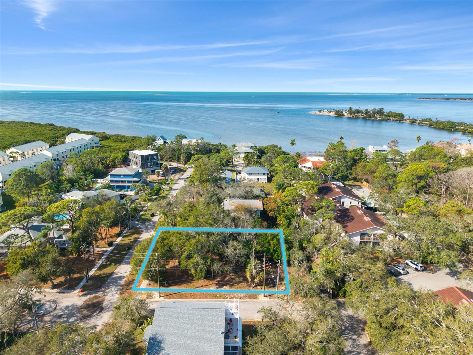 $5,000 PRICE DROP! Excellent opportunity to build feet away from the beautiful GULF!!!  
Rare opportunity in sought-after Tarpon Springs! This corner lot is perfectly positioned on a quiet dead-end street, offering privacy while being just walking distance to the Gulf of Mexico.
**Design without limits in one of Tarpon Springs’ most coveted coastal enclaves.** This expansive **.31-acre corner homesite (13,000+ sq ft)** sits on a **private dead-end street**, just **steps from the Gulf of Mexico**, offering the ideal canvas for a bespoke coastal estate.

Surrounded by **new luxury construction commanding up to $1.5M**, this property delivers the rare combination of **privacy, prestige, and proximity to the water**. With **no HOA**, you have the freedom to create a custom residence tailored to your vision—whether that includes a resort-style pool, expansive outdoor living, or a striking modern coastal design.

Offered at **$195,000**, this is an exceptional opportunity to secure a premium lot in a rapidly appreciating luxury market.

Give us a call to communicate directly with our builder. Renderings on request.
