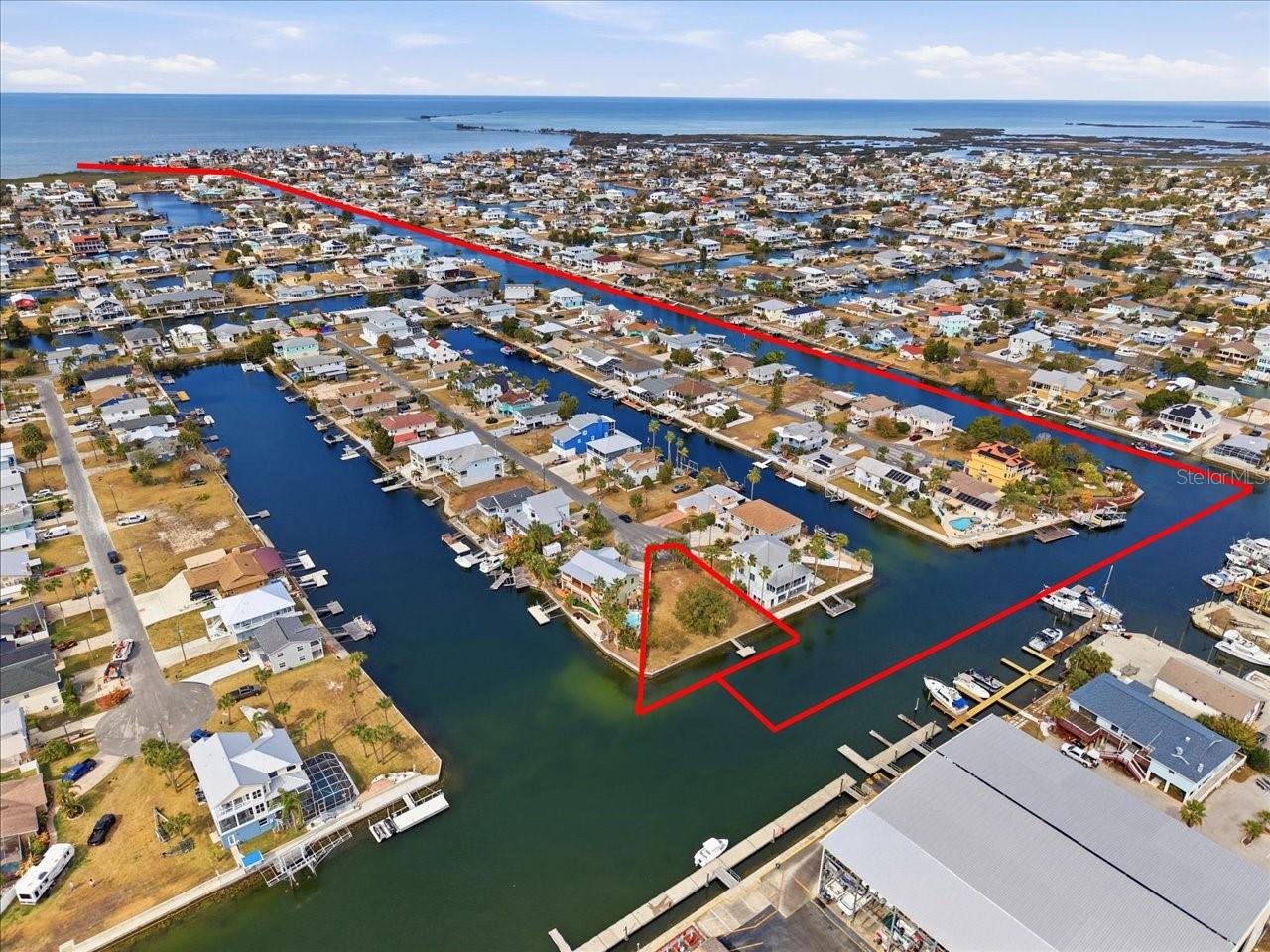 Check this out! A Incredible waterfront lot in Hernando Beach — build your dream home on this prime 8,508 sq ft, ready-to-go site at the end of a quiet cul-de-sac! With 125 feet of concrete seawall frontage on one of the neighborhood’s deepest canals, the property easily accommodates your boat, a boat lift, jet skis, a large floating dock or even a sailboat. Cruise minutes by boat to the Gulf for a perfect day on the flats and end your day with the one and only spectacular Hernando Beach Sunset! The parcel is already chain-link fenced, features a new floating dock, and has water, sewer and power at the street. There is no HOA and no rental restrictions, making it an ideal location for short-term rentals or an Airbnb. Located close to Hernando Beach Marina if you choose to keep your boat high and dry and just minutes from all the action in the community like Weeki Wachee Springs, Local restaurants and nature trails at the preserves! Not to mention street legal Golf carts are allowed in this neighborhood! This lot delivers the ultimate Florida lifestyle—boating, fishing, paddleboarding and endless sunshine! This is a rare opportunity to own a premier waterfront parcel in a one-of-a-kind Hernando Beach community! Just awaiting you and your future built dream home! schedule your showing today!