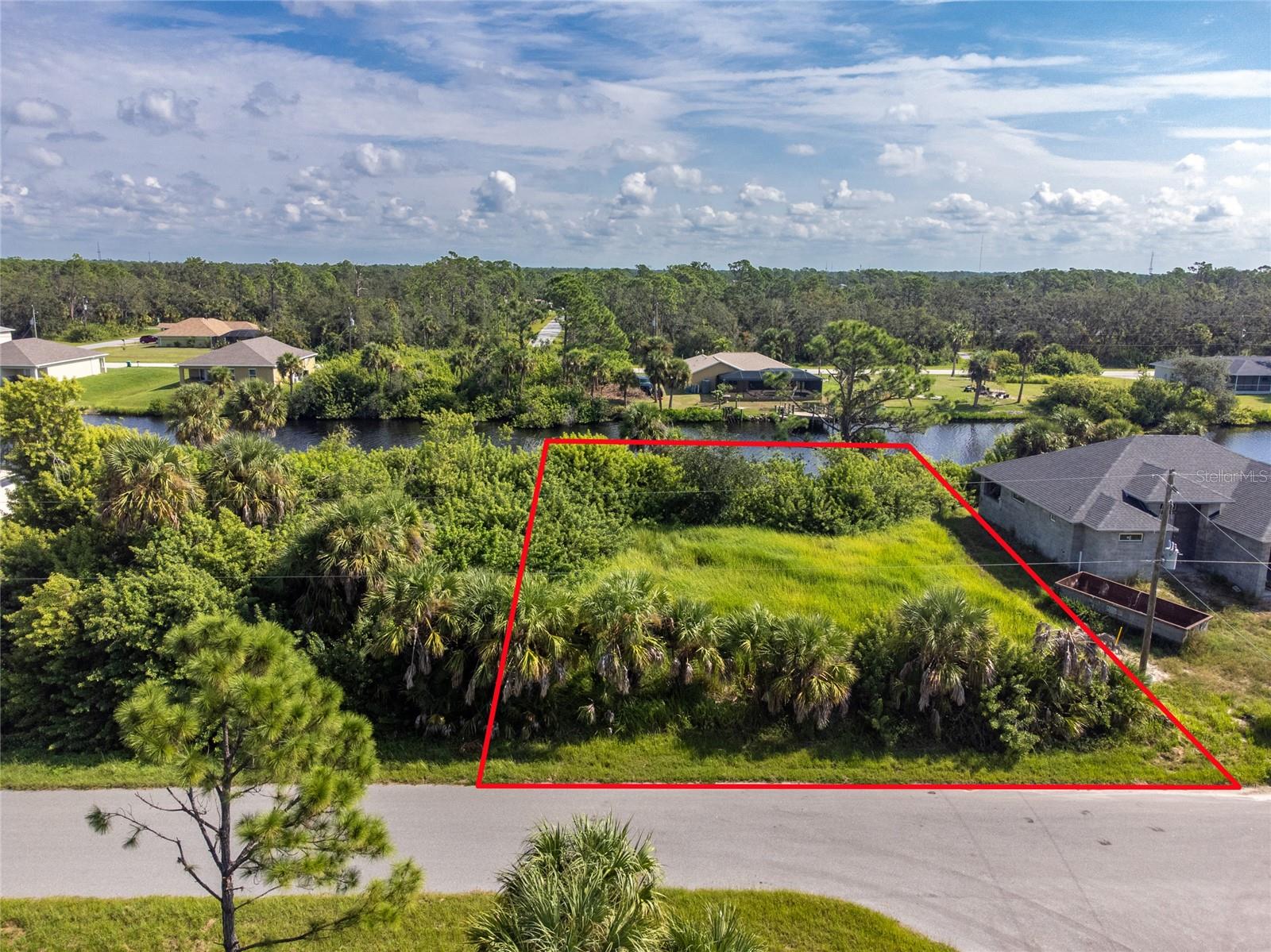 Imagine pulling into the driveway of a home designed entirely around your lifestyle, where every detail reflects your vision. At 2162 Doolittle Lane in Port Charlotte, that opportunity begins with a blank canvas waiting for your dream home.
This homesite offers the rare chance to build exactly what you've always wanted—whether it's a modern coastal retreat, a charming Florida ranch, or a luxurious custom residence with room for a boat, workshop, or outdoor kitchen. Instead of remodeling someone else's vision, you can create a home perfectly suited to your needs from the ground up.
This isn't just a vacant lot—it's the foundation for your next chapter. The sunsets, the palm trees, the coastal breezes, and the home you've always imagined are all waiting to become your reality. Bring your builder, bring your plans, and start creating the Florida lifestyle you've been dreaming about.